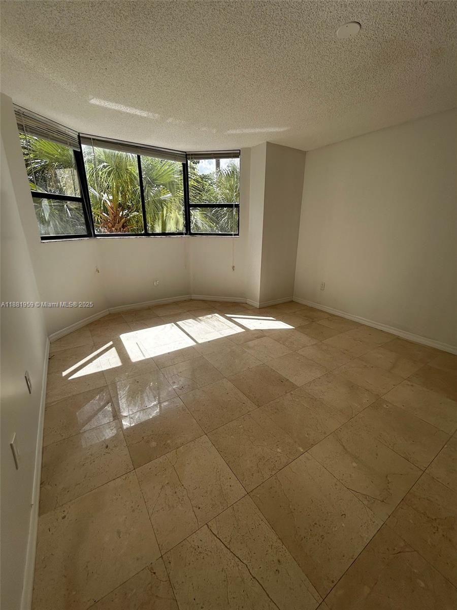 7451 Northwest 16th Street, Unit 304 Plantation, FL 33313 - Photo 23 of 59 a view of an empty room with a window