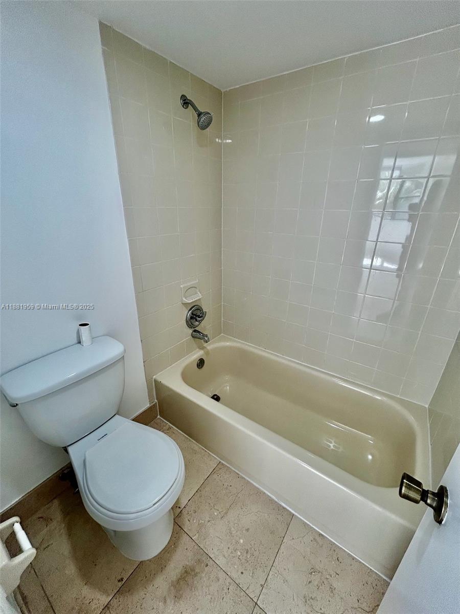 7451 Northwest 16th Street, Unit 304 Plantation, FL 33313 - Photo 28 of 59 a bathroom with a toilet a sink and bathtub