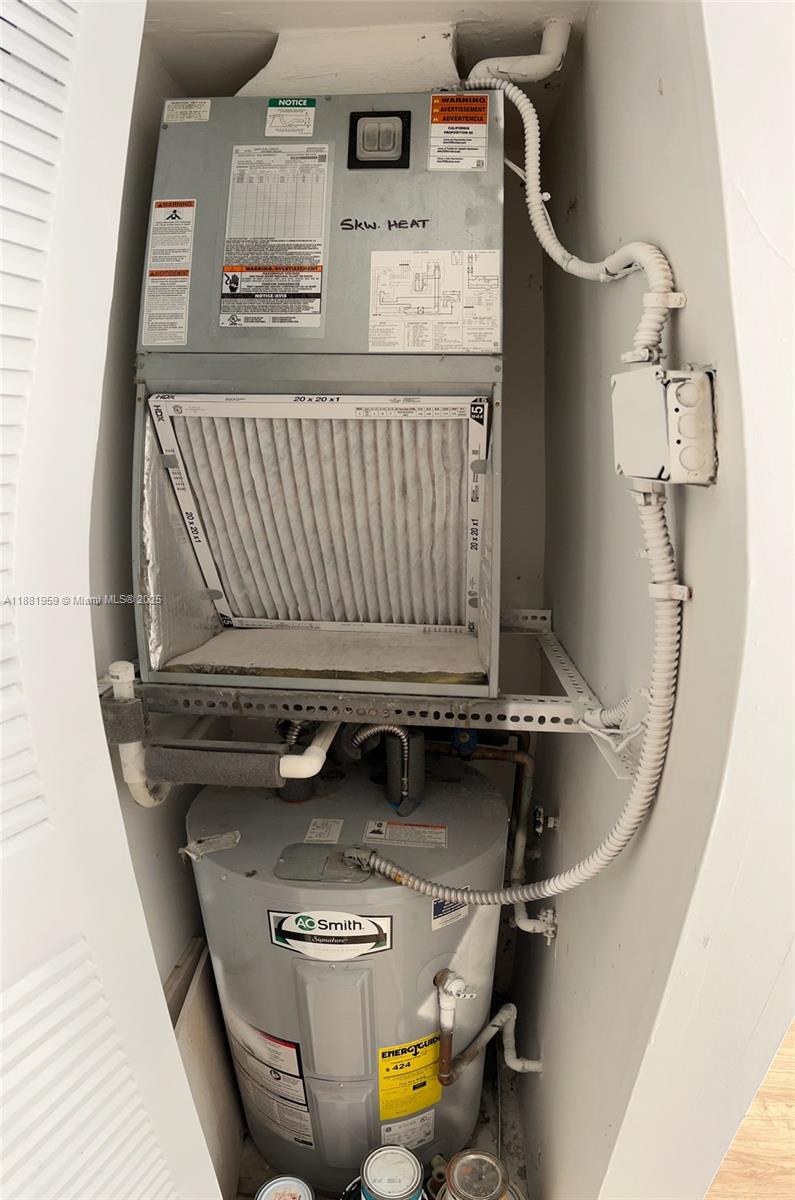 7451 Northwest 16th Street, Unit 304 Plantation, FL 33313 - Photo 29 of 59 a utility room with dryer and washer