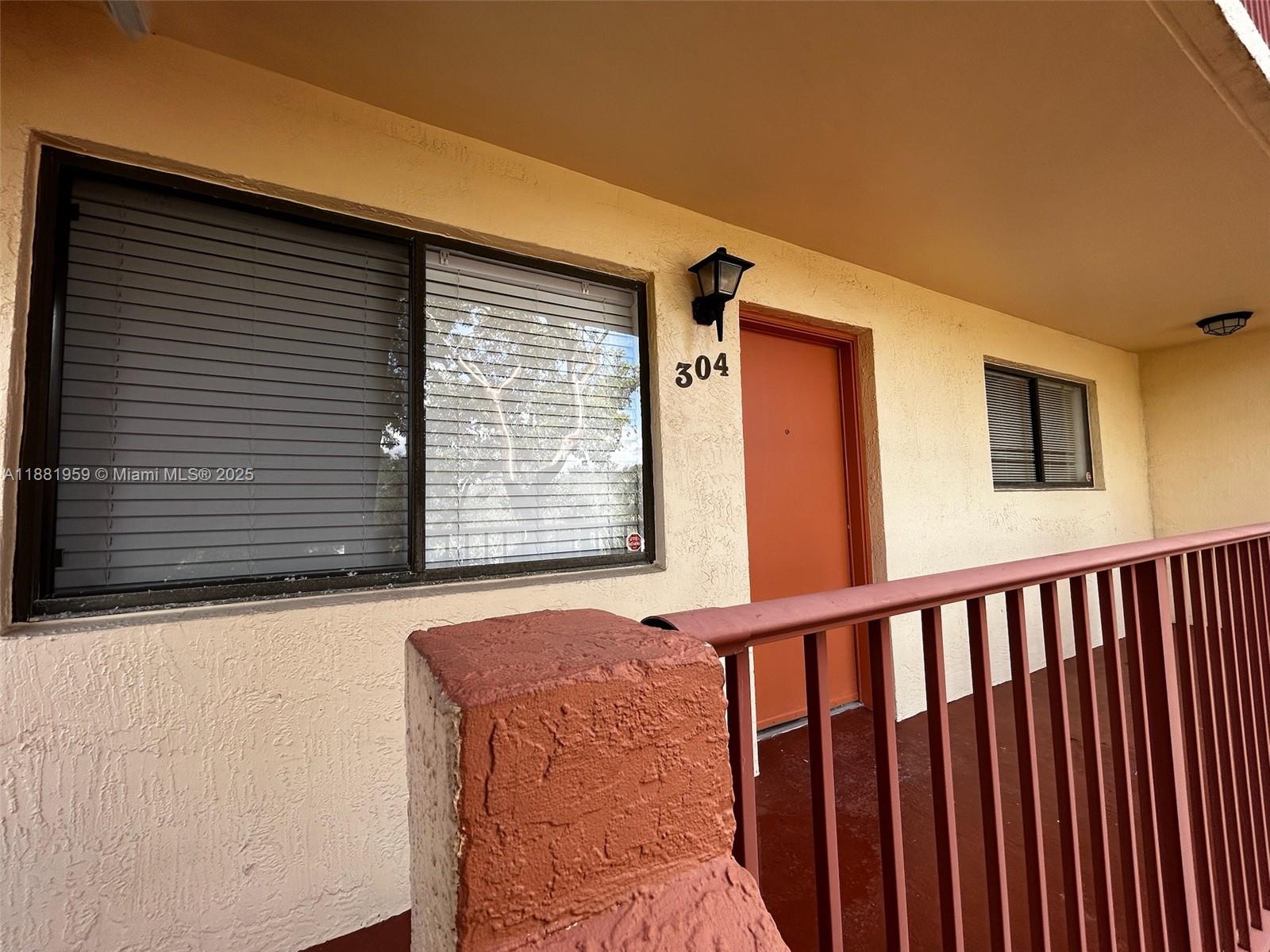 7451 Northwest 16th Street, Unit 304 Plantation, FL 33313 - Photo 39 of 59 a view of a house with a window