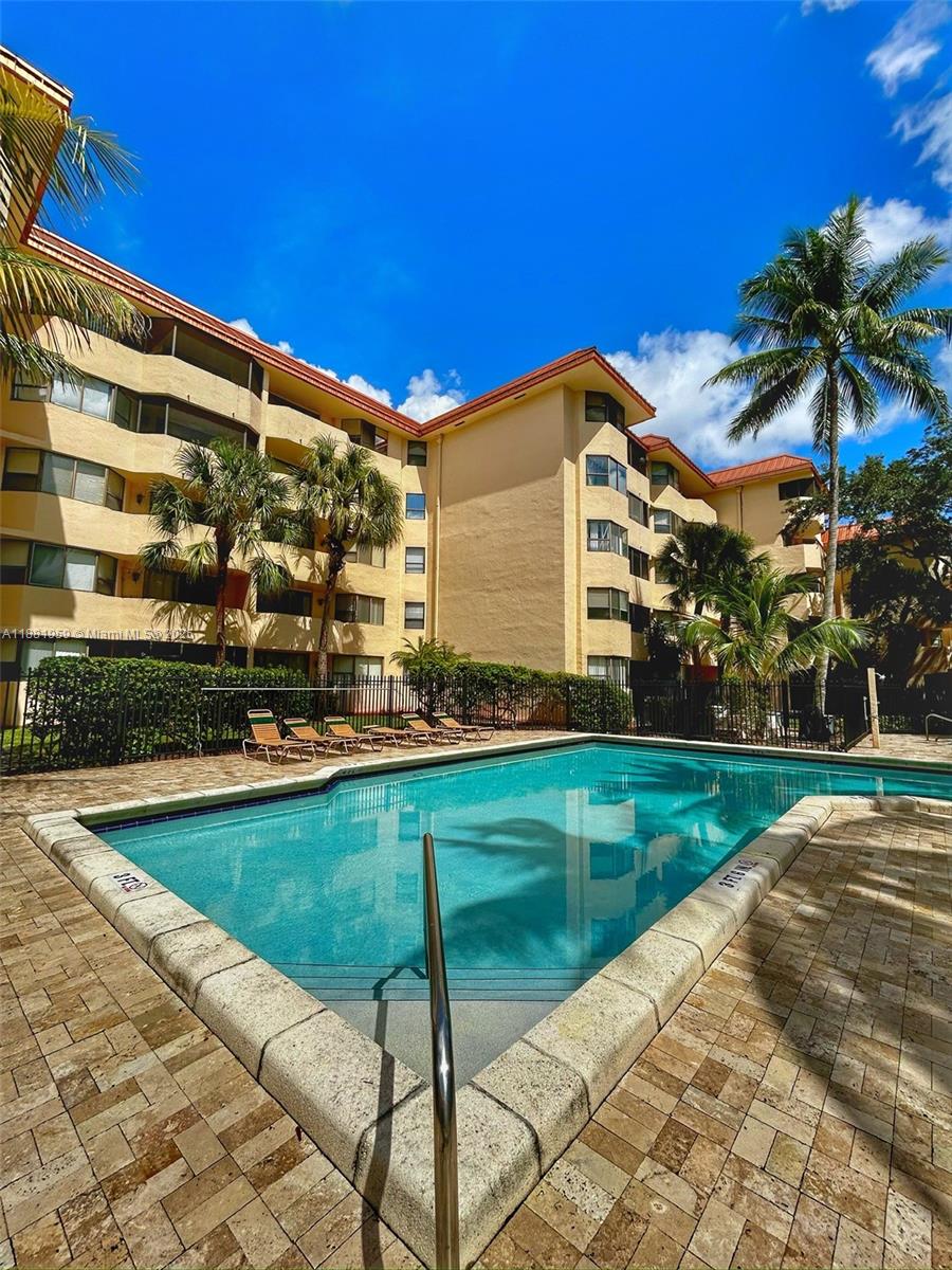 7451 Northwest 16th Street, Unit 304 Plantation, FL 33313 - Photo 40 of 59 a view of a house with a backyard