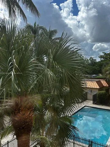 a front view of a house with garden space and street view