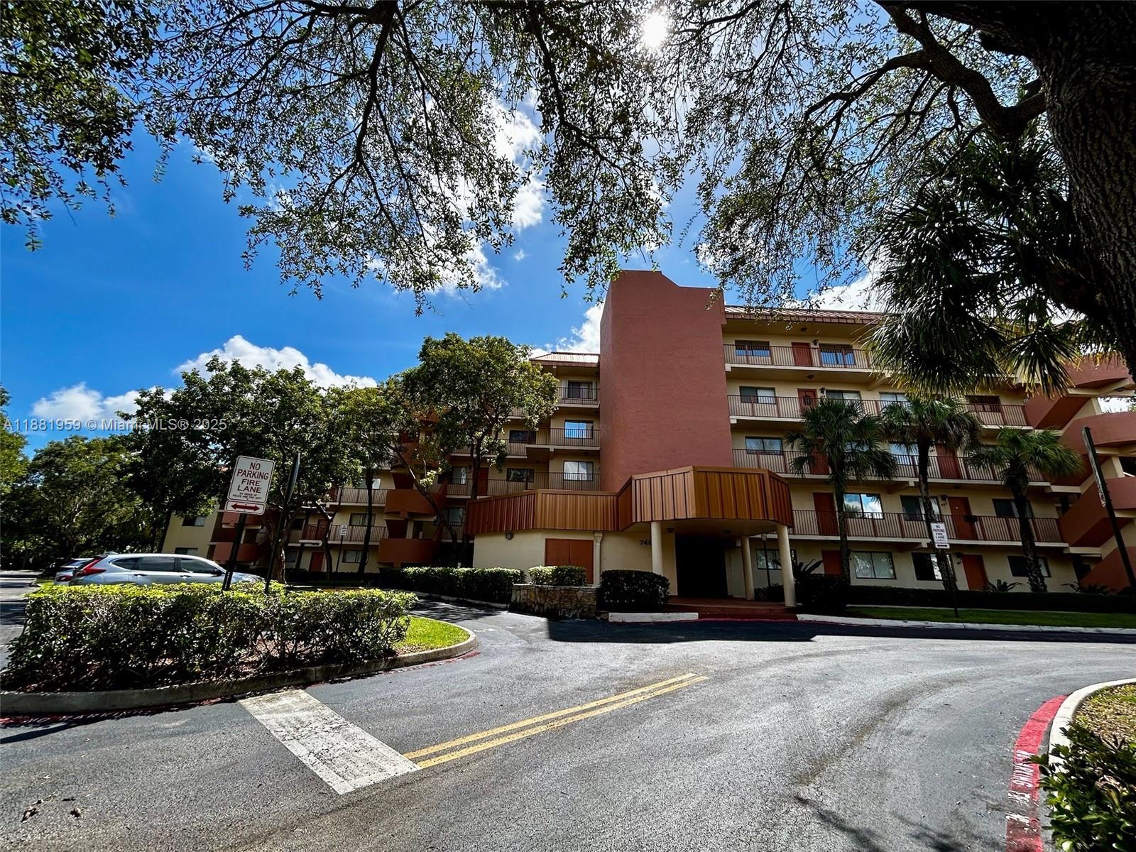 7451 Northwest 16th Street, Unit 304 Plantation, FL 33313 - Photo 52 of 59 a view of a street with cars