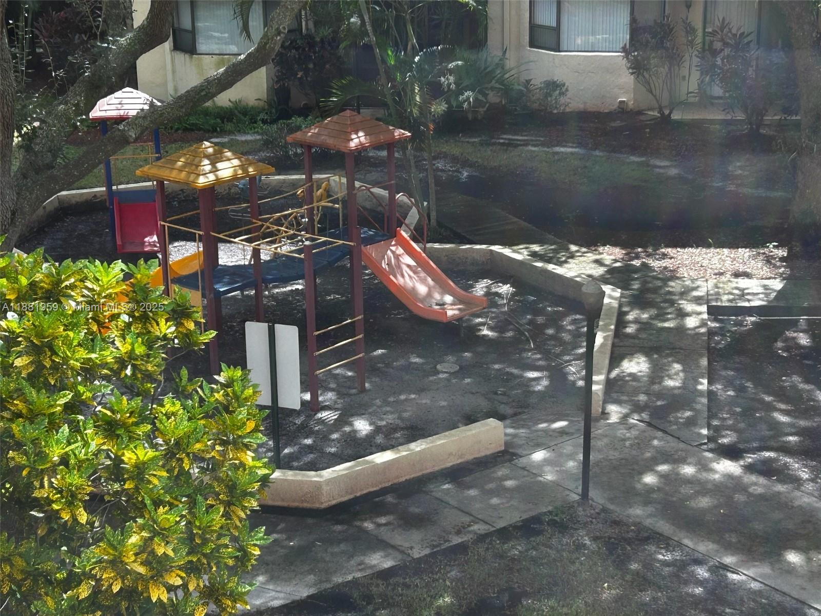 7451 Northwest 16th Street, Unit 304 Plantation, FL 33313 - Photo 56 of 59 a backyard of a house with lots of green space