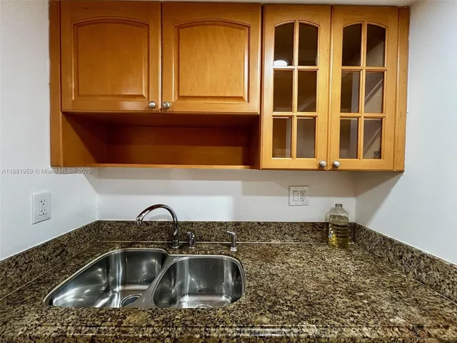 a kitchen with a sink and a window
