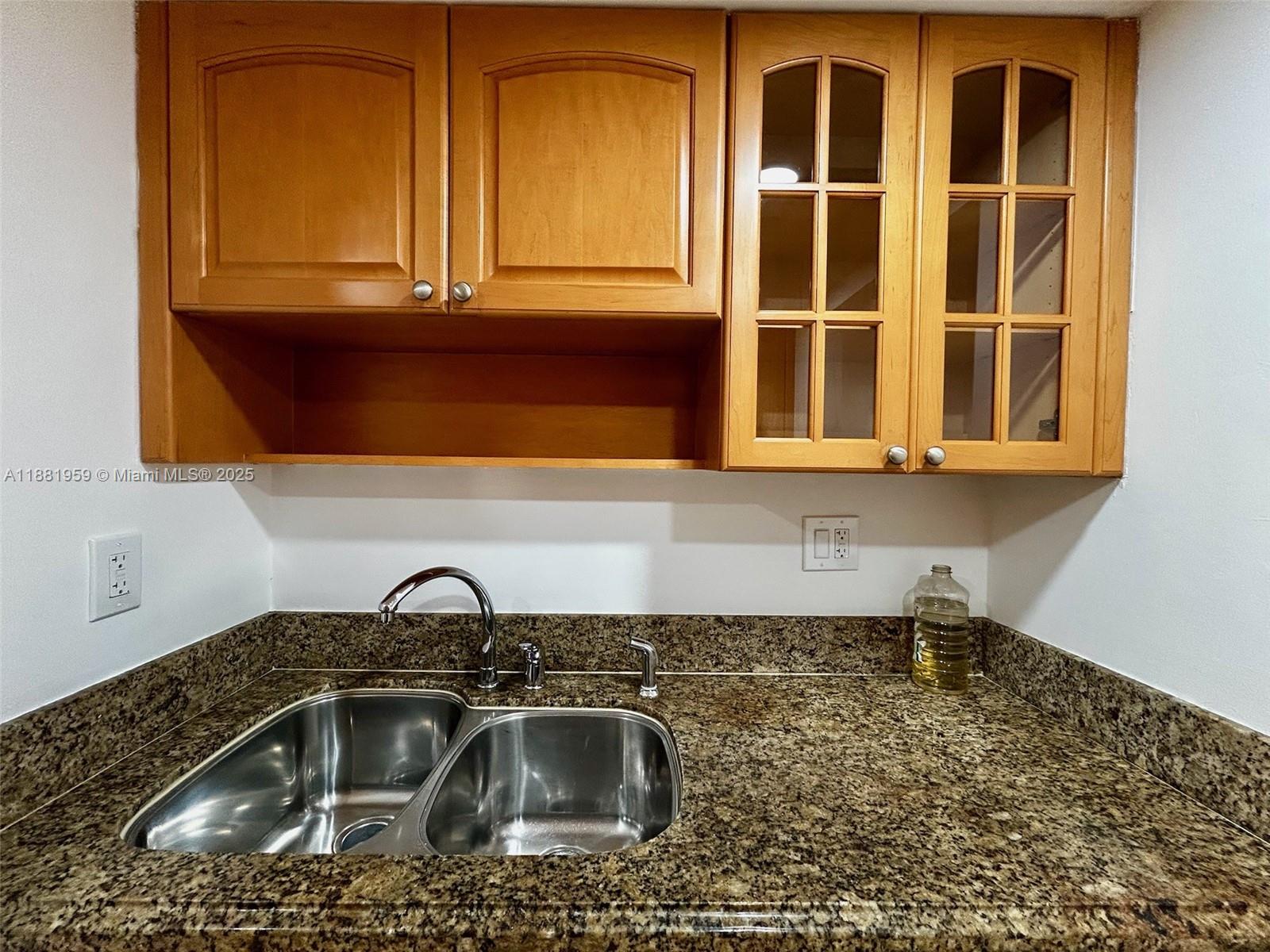 7451 Northwest 16th Street, Unit 304 Plantation, FL 33313 - Photo 7 of 59 a kitchen with a sink and a window