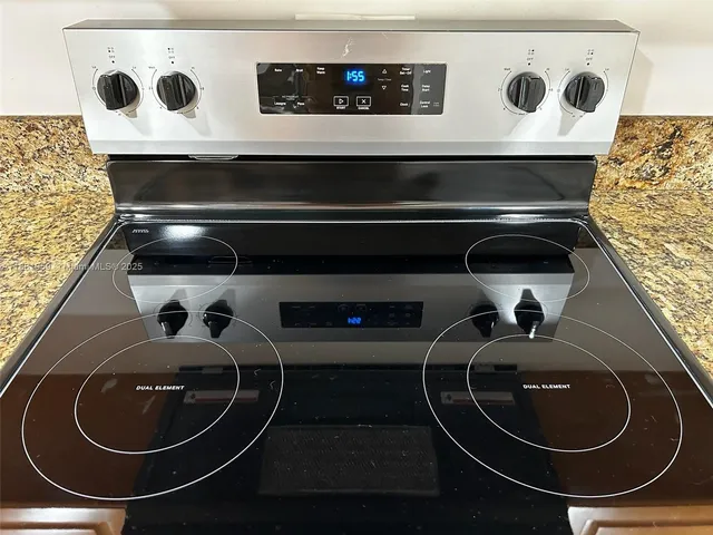 a stove top oven sitting inside of a kitchen
