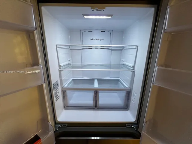 a kitchen with stainless steel appliances granite countertop a sink a stove a microwave and cabinets