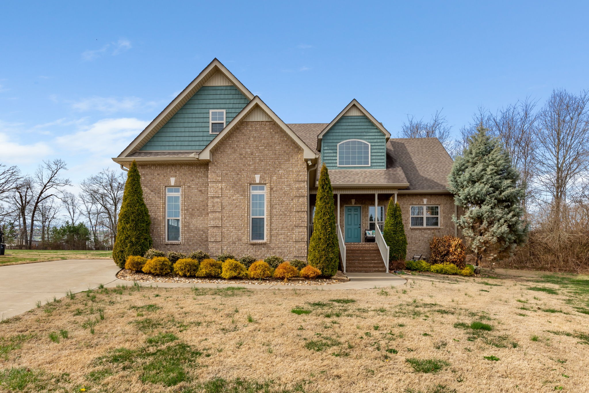 209 Hunters Ridge Drive Tullahoma, TN 37388 - Photo 1 of 54 a front view of a house with a yard