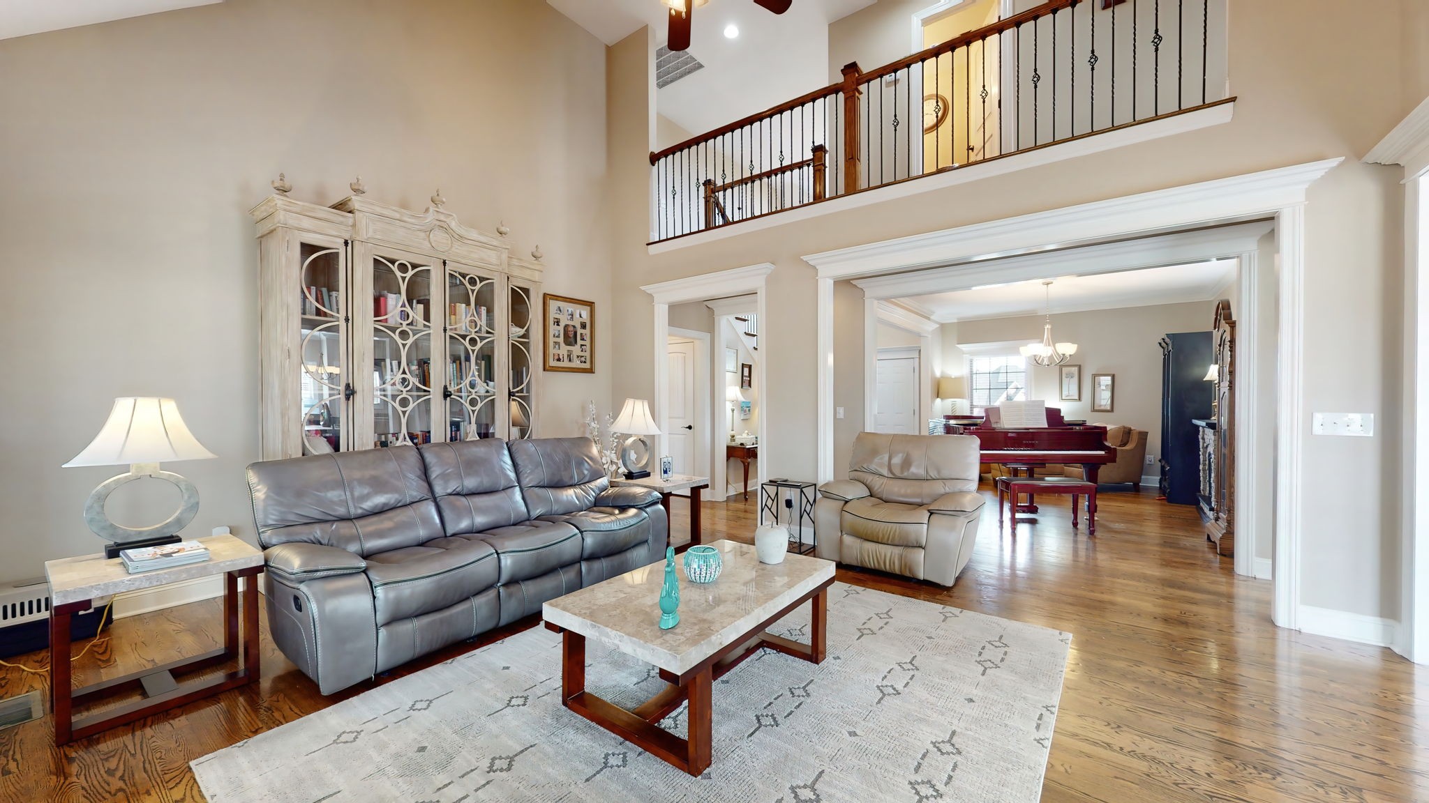 209 Hunters Ridge Drive Tullahoma, TN 37388 - Photo 12 of 54 a living room with furniture and a dining table with wooden floor