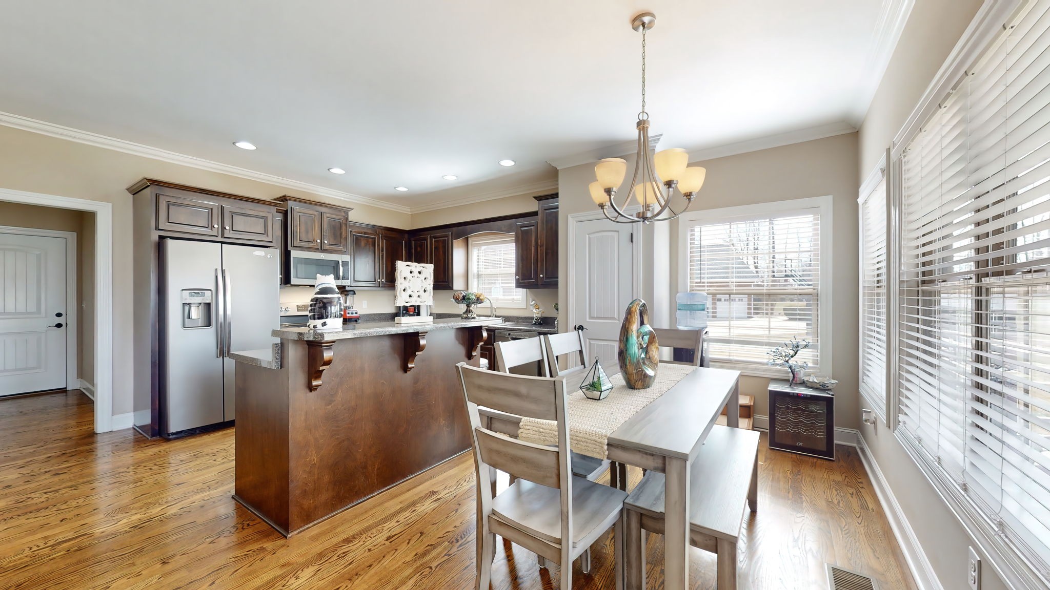 209 Hunters Ridge Drive Tullahoma, TN 37388 - Photo 13 of 54 a dining room with kitchen island stainless steel appliances furniture a chandelier and a view of kitchen