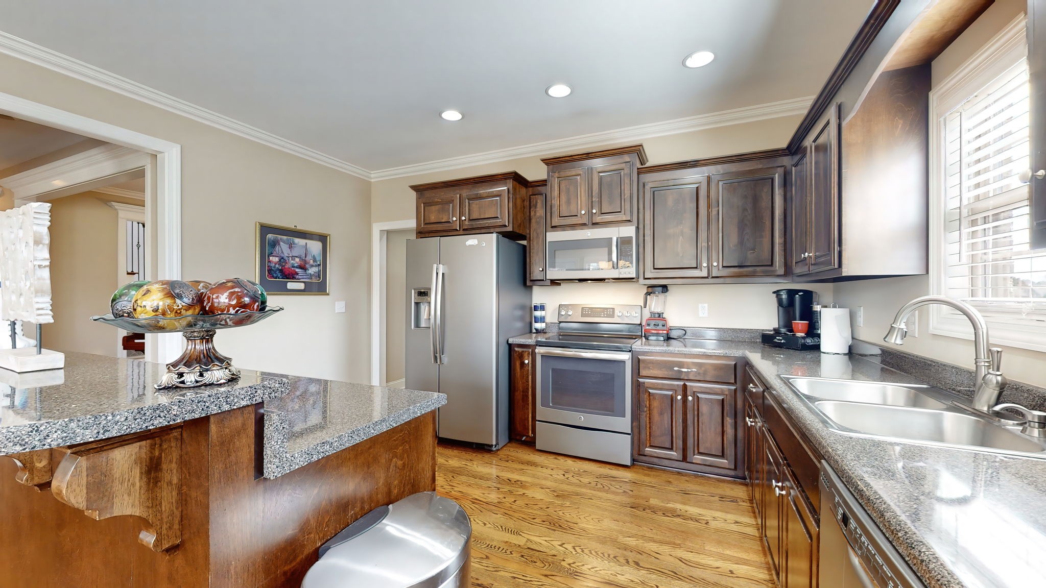 209 Hunters Ridge Drive Tullahoma, TN 37388 - Photo 16 of 54 a kitchen with stainless steel appliances granite countertop a sink refrigerator and cabinets