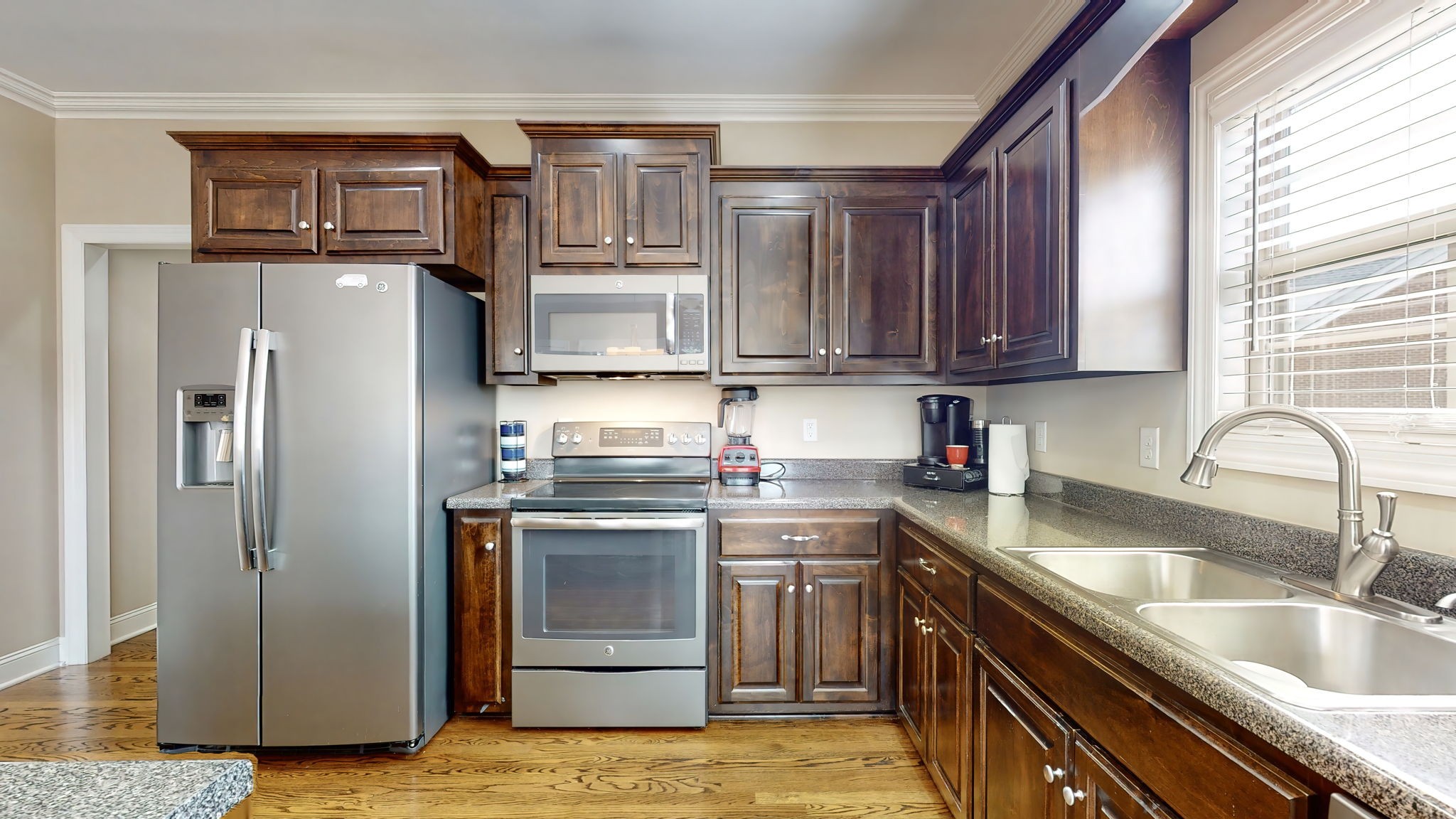 209 Hunters Ridge Drive Tullahoma, TN 37388 - Photo 19 of 54 a kitchen with stainless steel appliances granite countertop a sink stove and refrigerator
