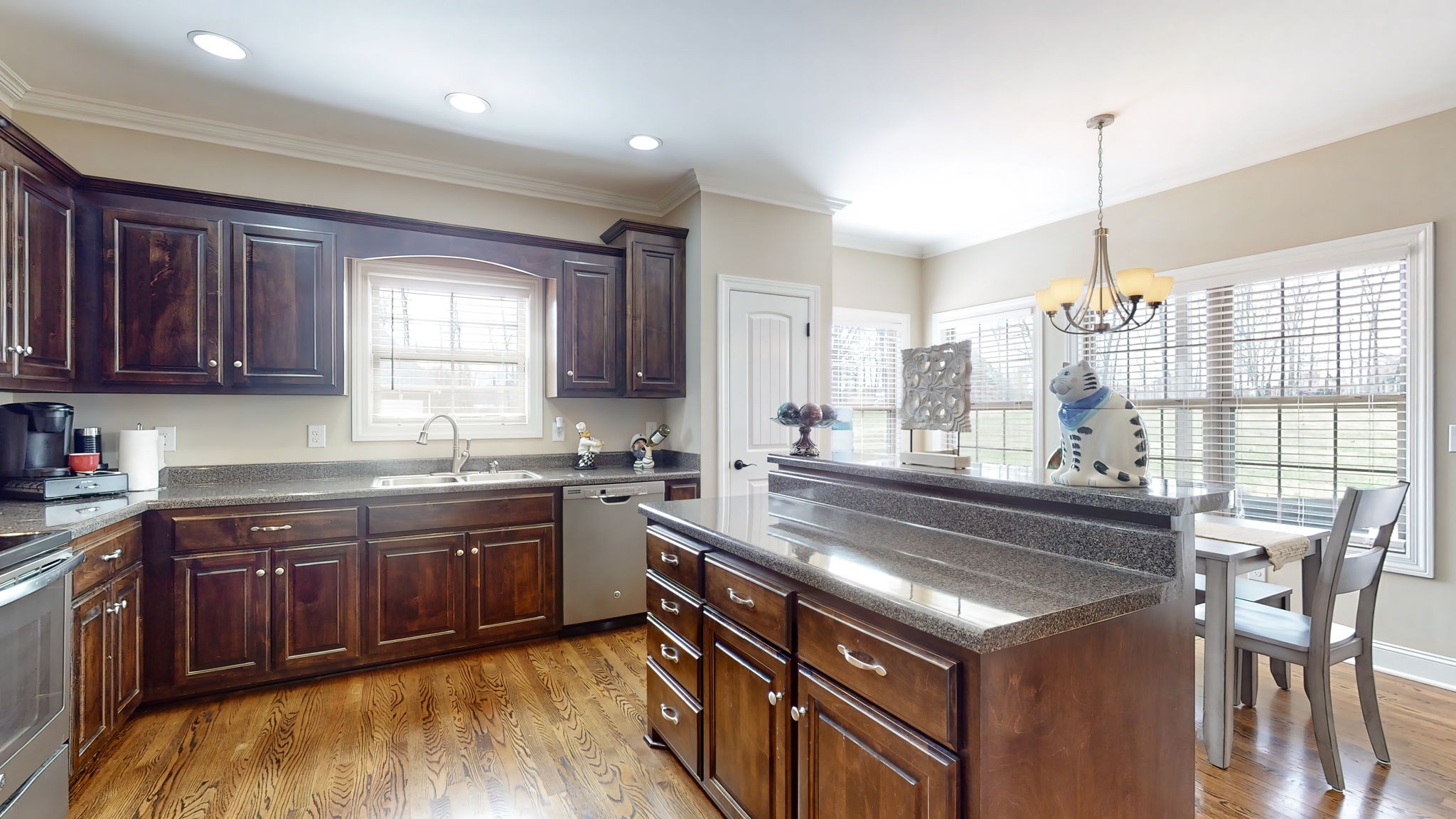 209 Hunters Ridge Drive Tullahoma, TN 37388 - Photo 20 of 54 a kitchen with stainless steel appliances granite countertop a stove a sink and a refrigerator