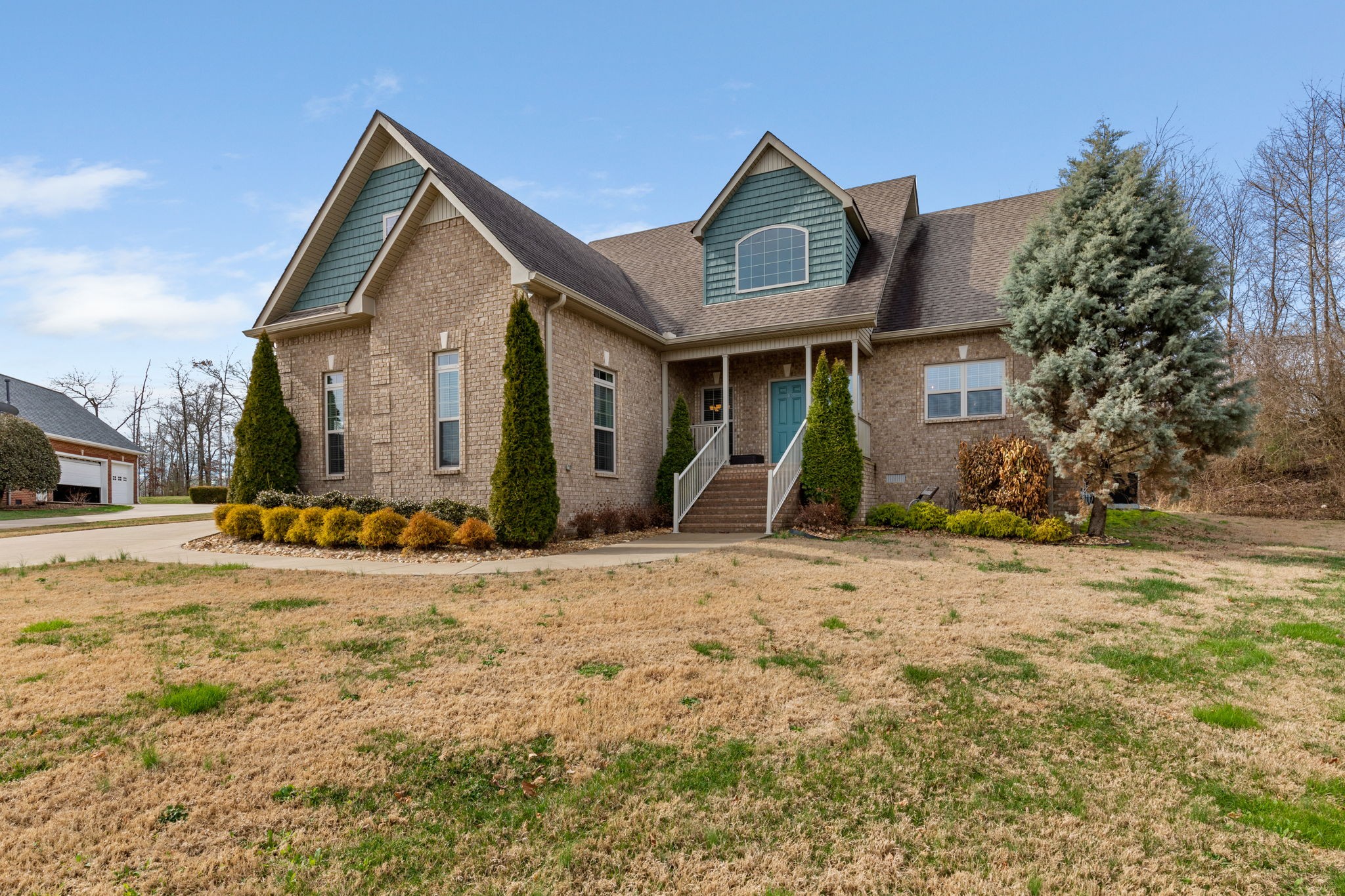 209 Hunters Ridge Drive Tullahoma, TN 37388 - Photo 2 of 54 a front view of a house with a yard