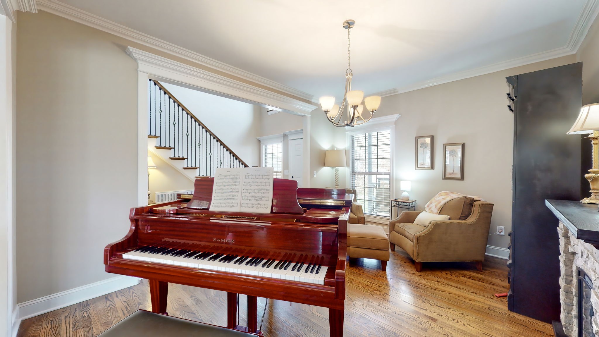 209 Hunters Ridge Drive Tullahoma, TN 37388 - Photo 23 of 54 a living room with furniture piano and a chandelier