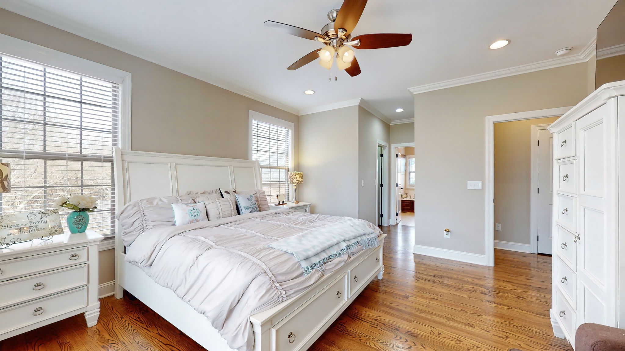 209 Hunters Ridge Drive Tullahoma, TN 37388 - Photo 28 of 54 a bedroom with a large bed and a chandelier