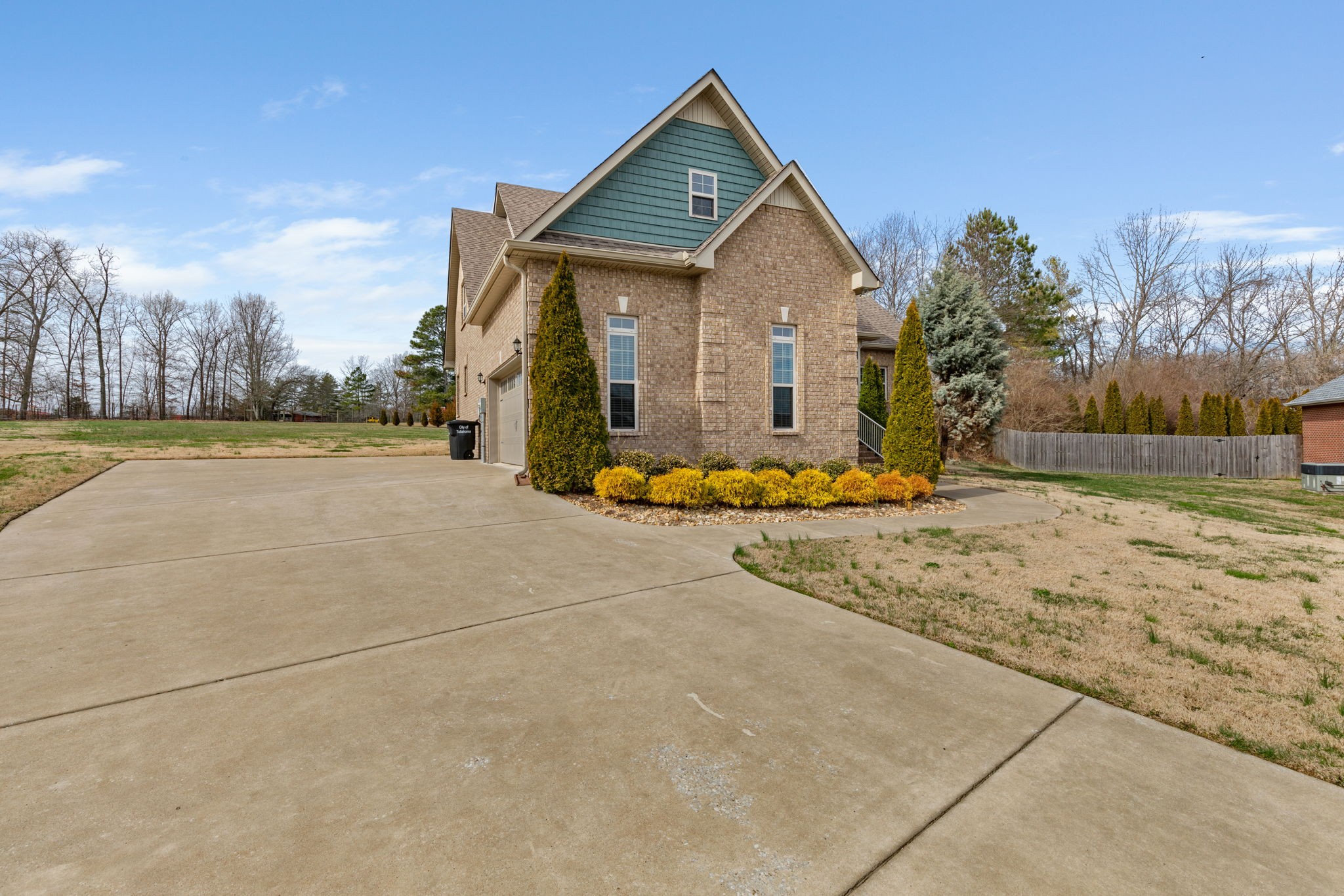 209 Hunters Ridge Drive Tullahoma, TN 37388 - Photo 3 of 54 a front view of a house with a yard