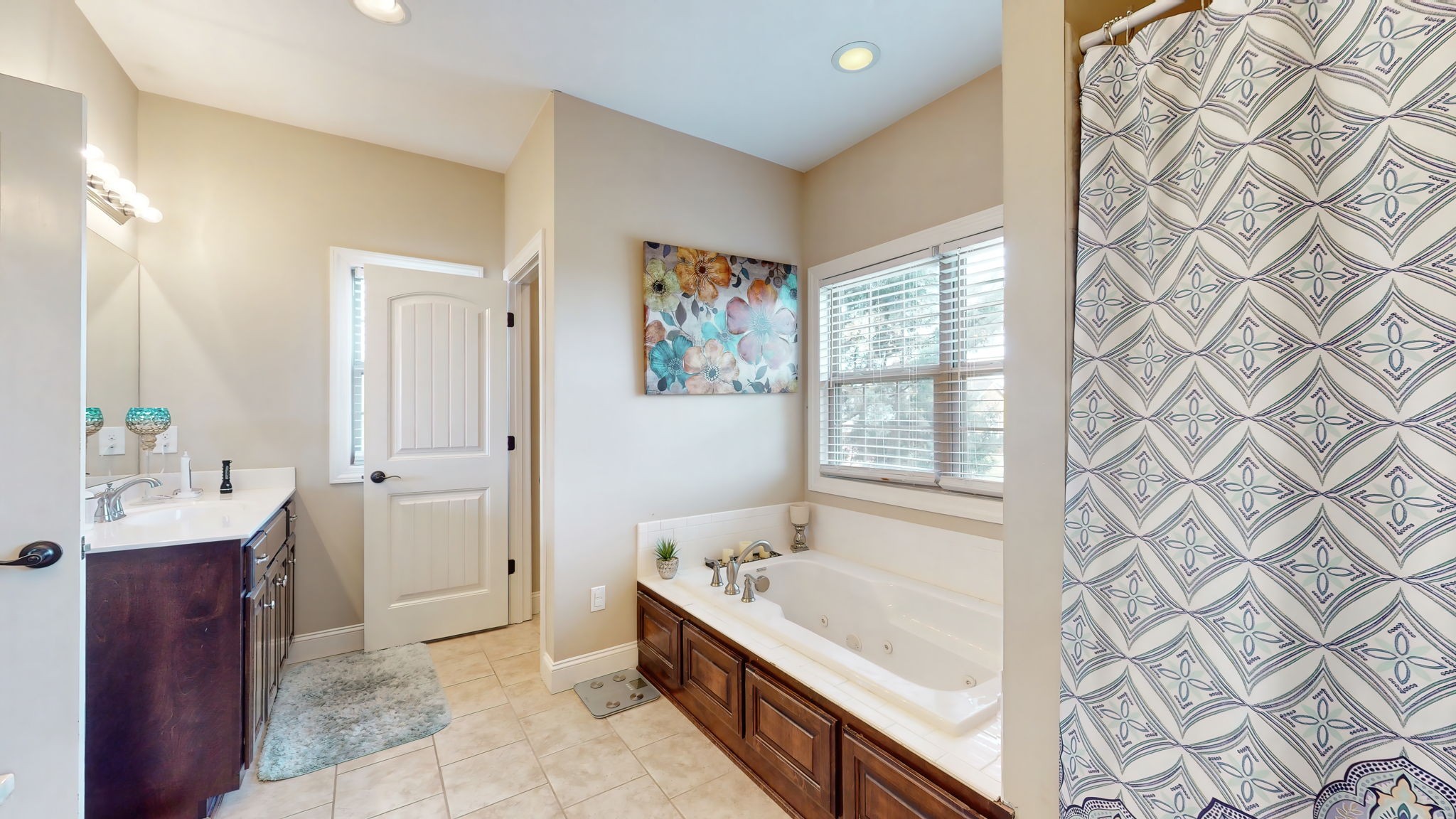 209 Hunters Ridge Drive Tullahoma, TN 37388 - Photo 33 of 54 a bathroom with a tub sink and mirror