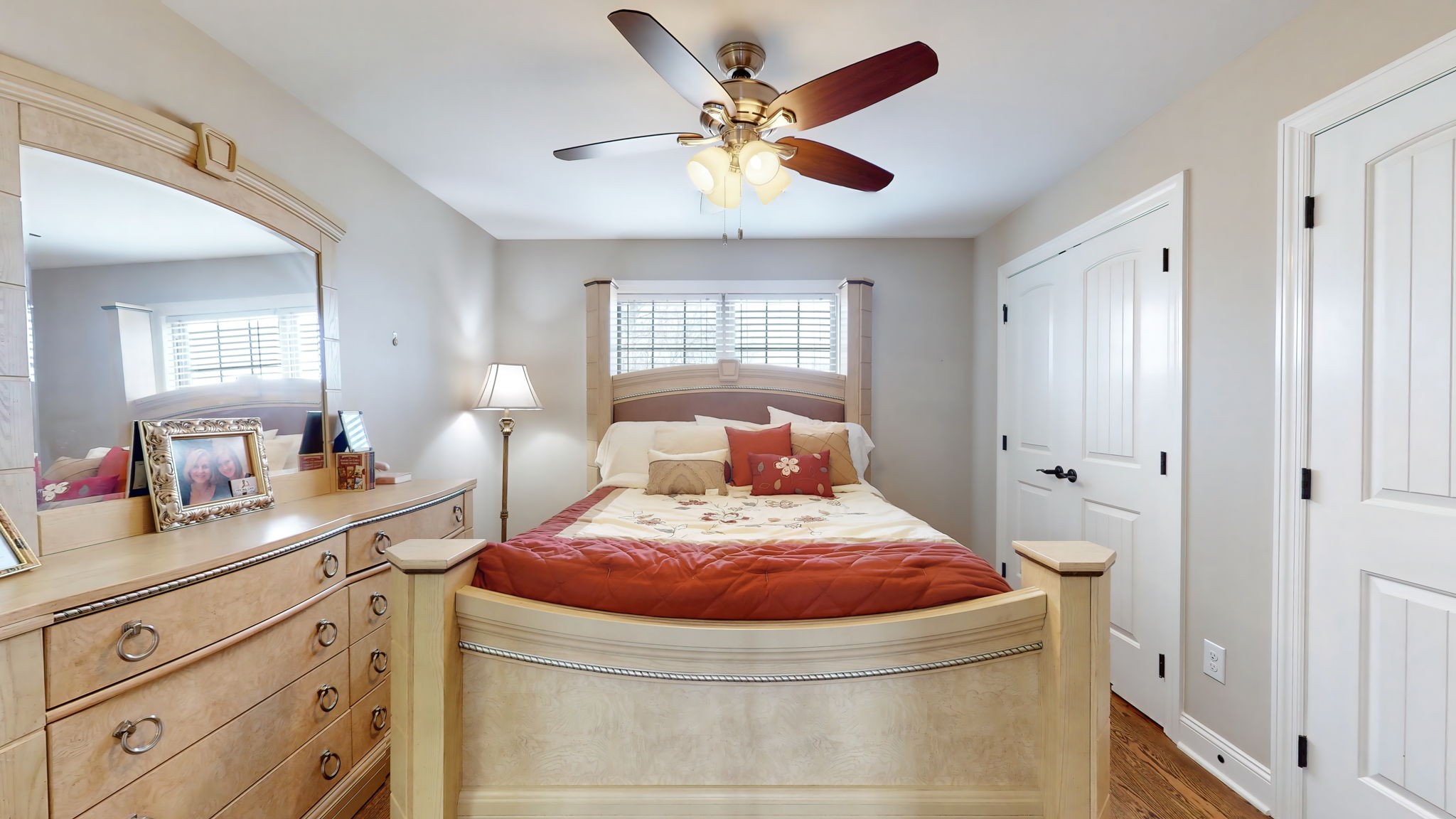 209 Hunters Ridge Drive Tullahoma, TN 37388 - Photo 37 of 54 a bedroom with a bed and a chandelier