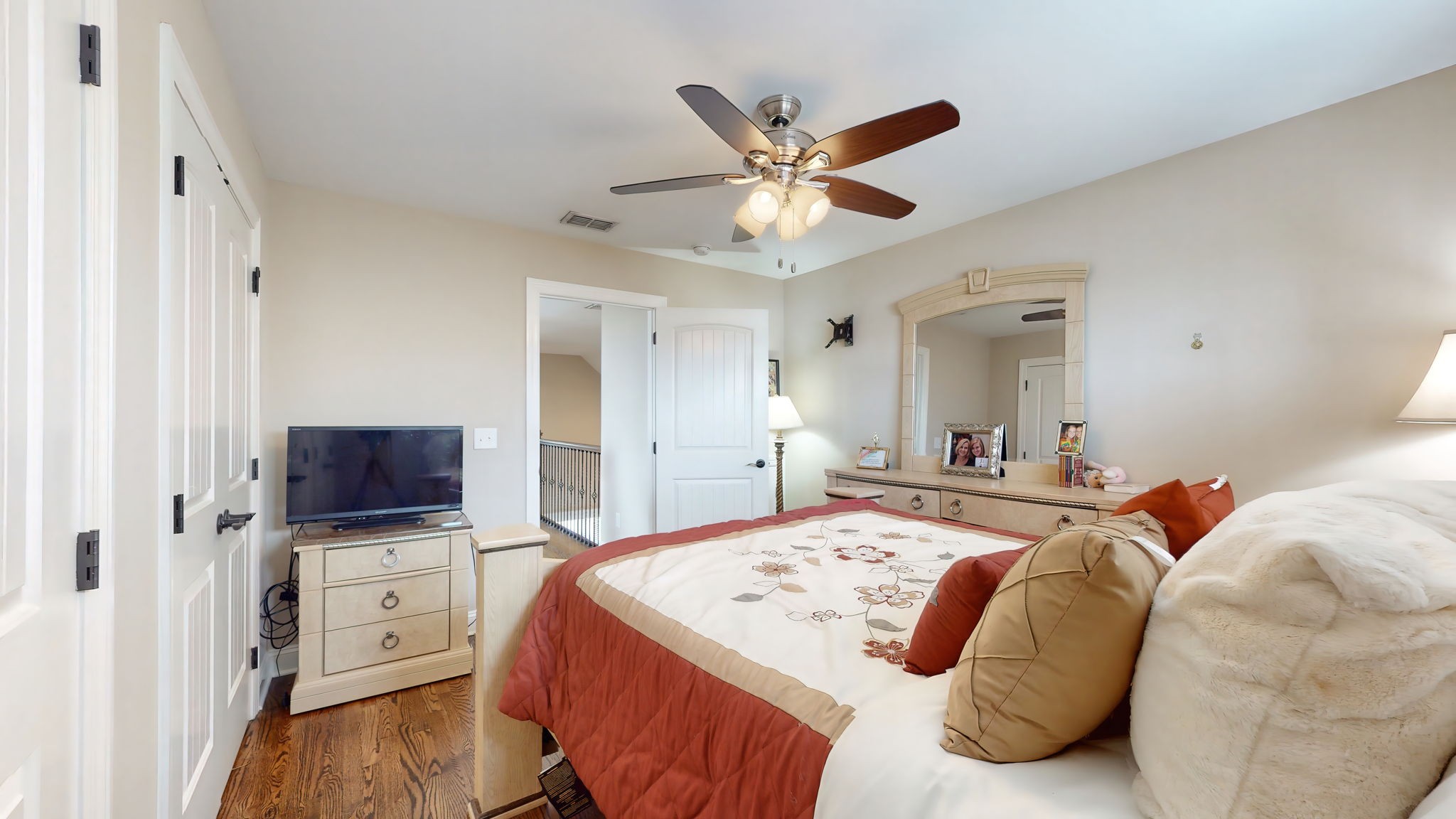 209 Hunters Ridge Drive Tullahoma, TN 37388 - Photo 40 of 54 a spacious bedroom with a bed and a flat screen tv