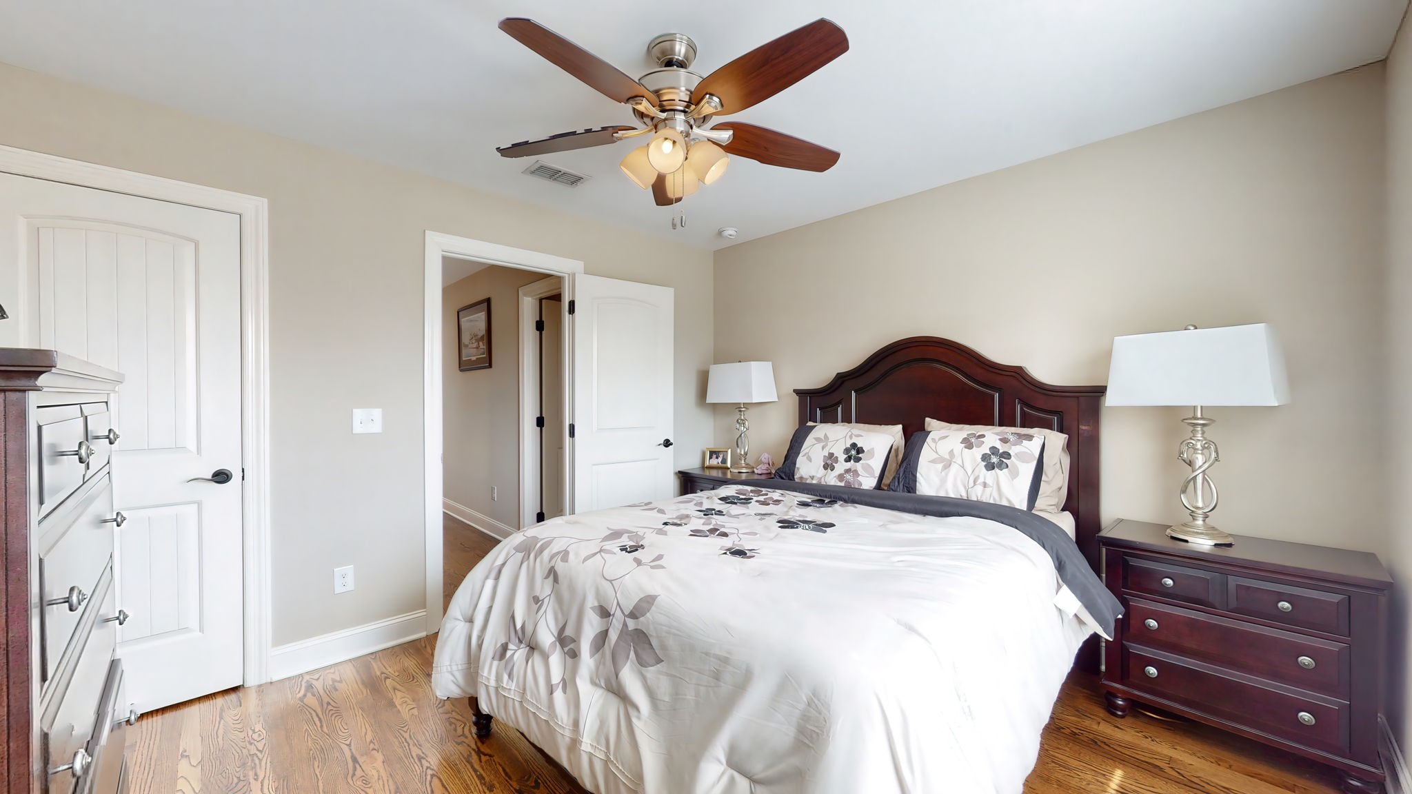 209 Hunters Ridge Drive Tullahoma, TN 37388 - Photo 43 of 54 a bedroom with a bed and a lamp on the dresser
