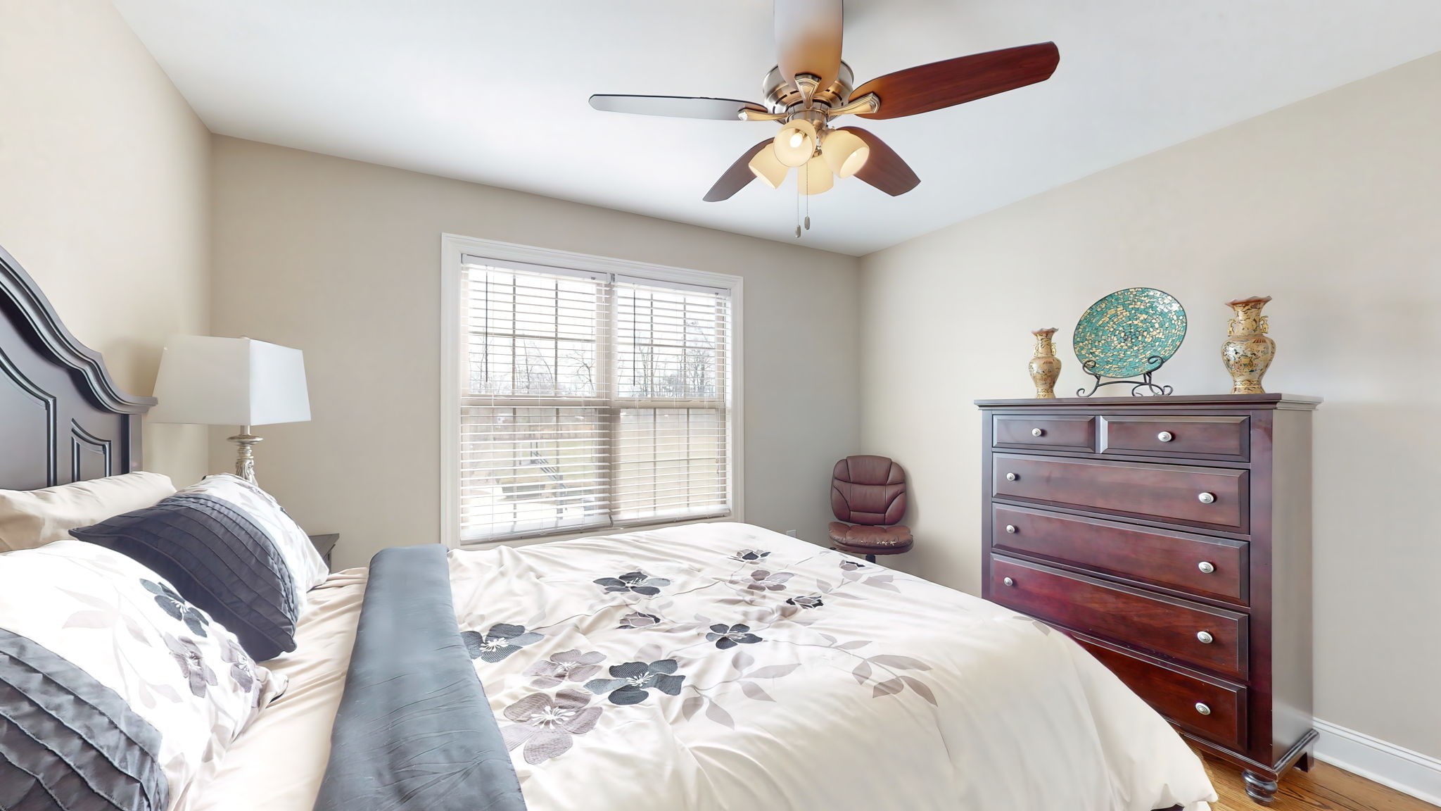 209 Hunters Ridge Drive Tullahoma, TN 37388 - Photo 46 of 54 a bedroom with a bed and a chandelier