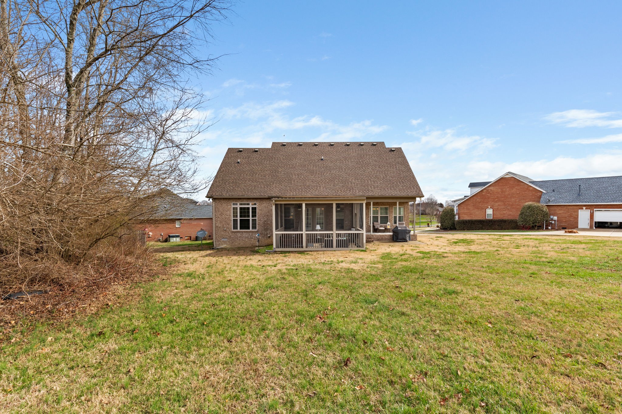 209 Hunters Ridge Drive Tullahoma, TN 37388 - Photo 8 of 54 a view of a big house with a big yard and large tree