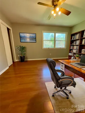 a workspace with furniture and window