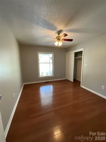 a bedroom with a large bed and a couch