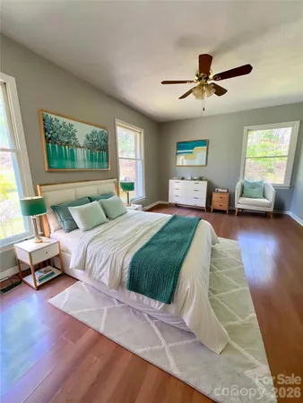 a bedroom with a large bed and a couch