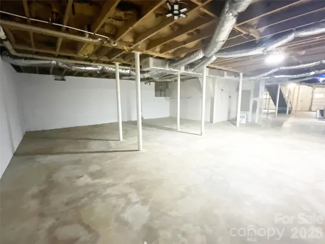 a house view with swimming pool in front of the house