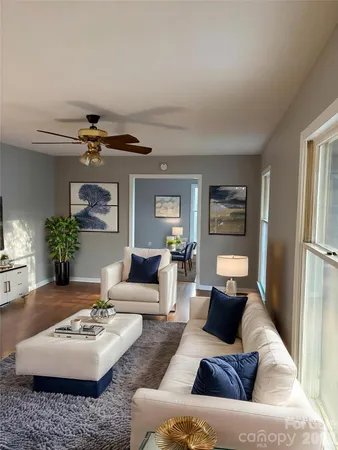 a living room with furniture and a table