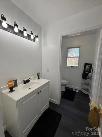 a room with a sink and cabinets