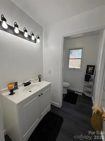 a room with a sink and cabinets