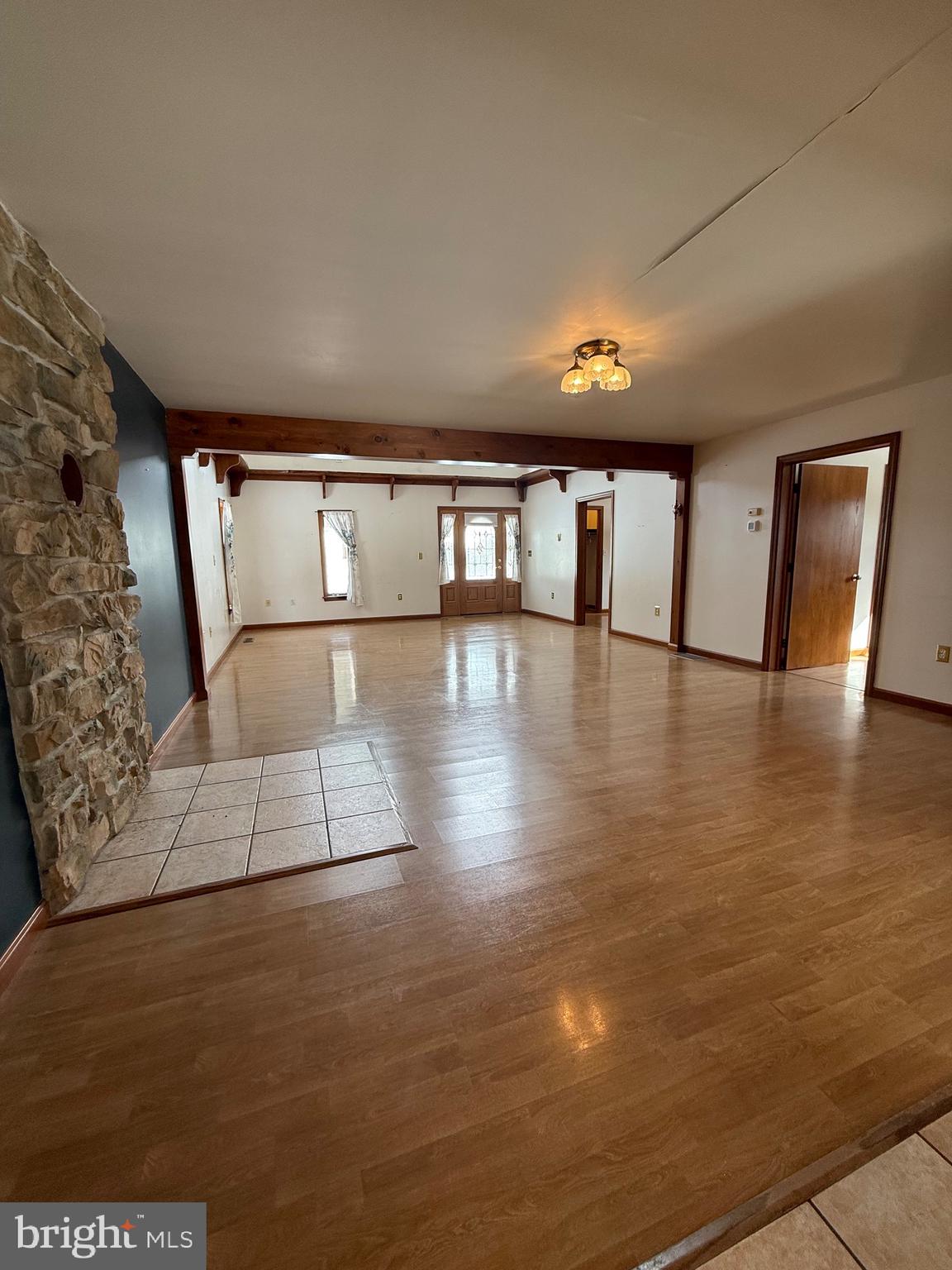 4776 Mcalevys Fort Road Petersburg, PA 16669 - Photo 17 of 75 a view of entryway with a floor to ceiling window and wooden floor