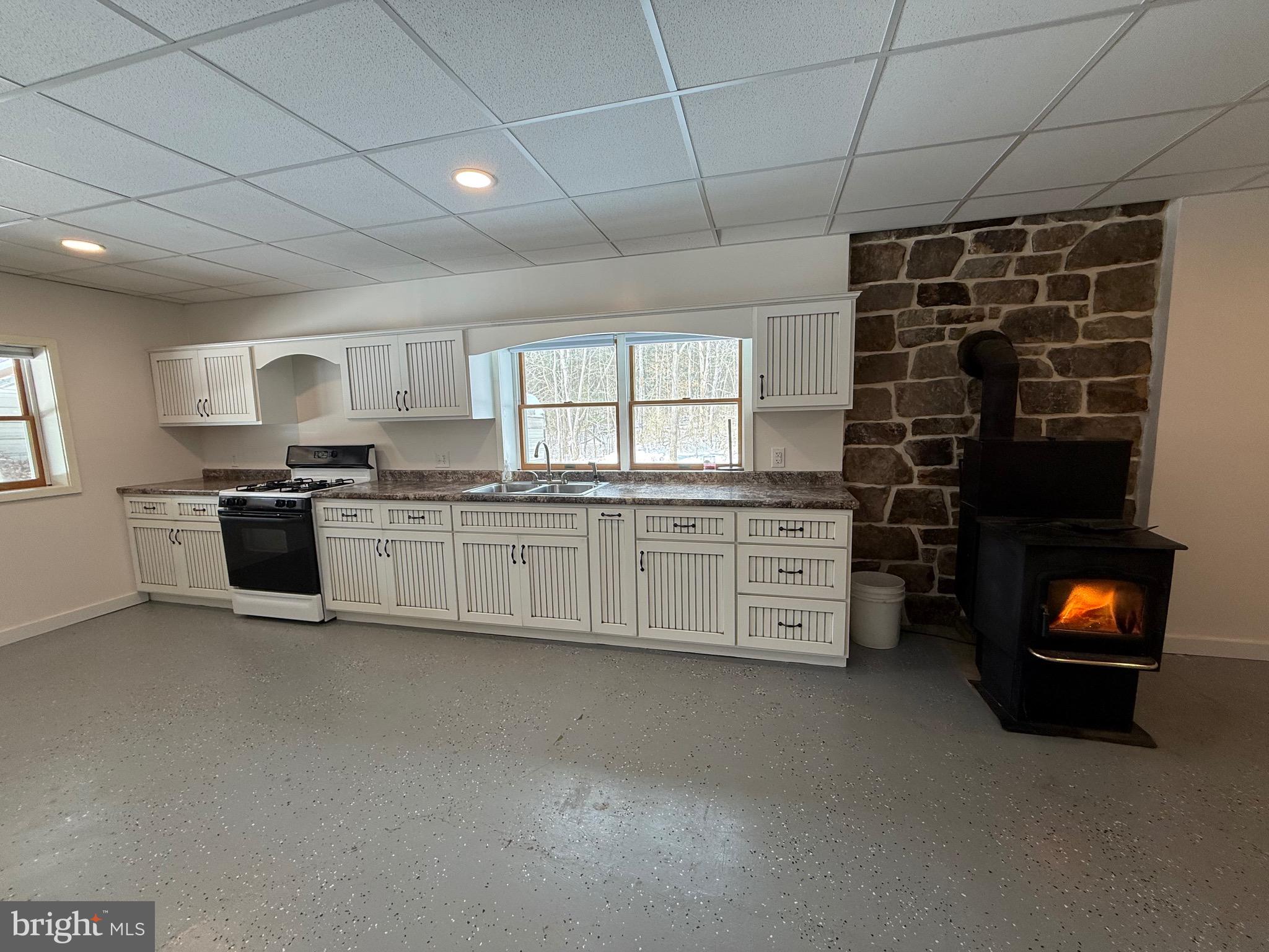 4776 Mcalevys Fort Road Petersburg, PA 16669 - Photo 64 of 75 a kitchen with stainless steel appliances granite countertop a stove sink and cabinets