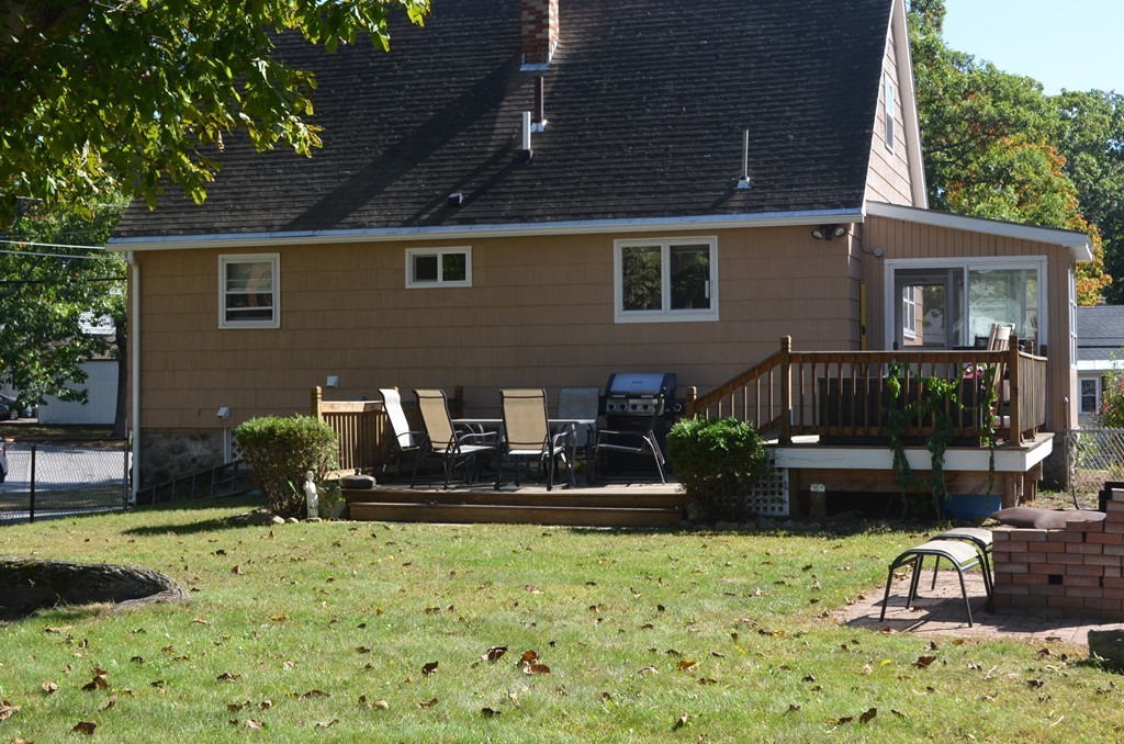 111 Acropolis Road Lowell, MA 01854 - Photo 4 of 15 a front view of a house with garden
