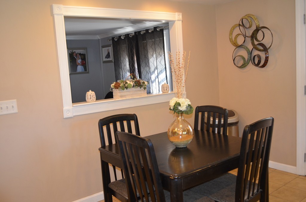 111 Acropolis Road Lowell, MA 01854 - Photo 6 of 15 a view of a dining room with furniture