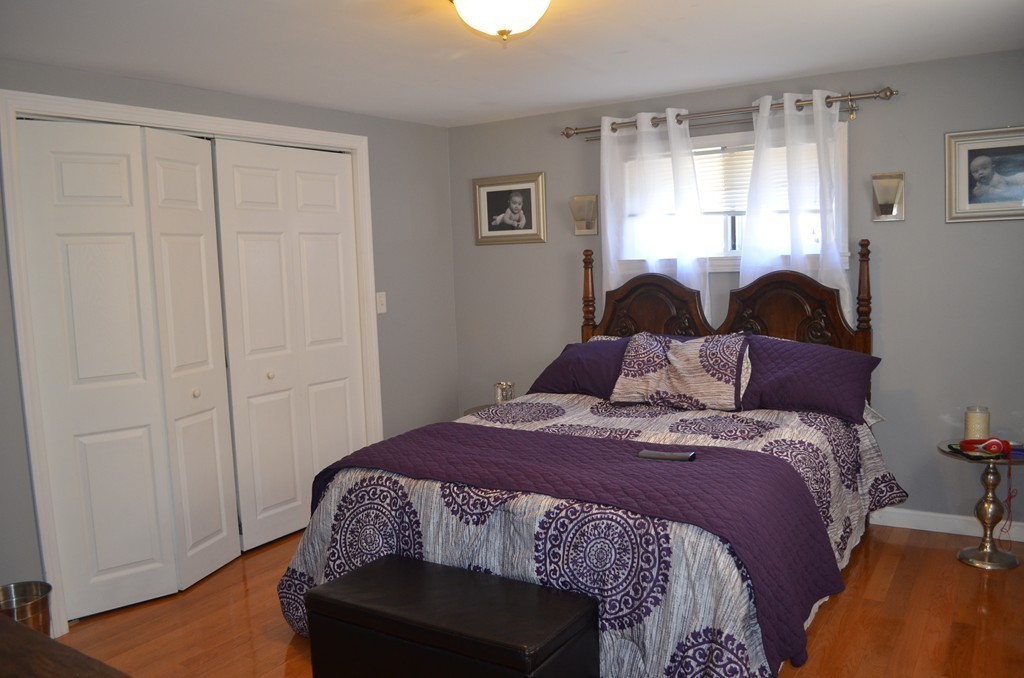 111 Acropolis Road Lowell, MA 01854 - Photo 9 of 15 a bedroom with a bed and a window