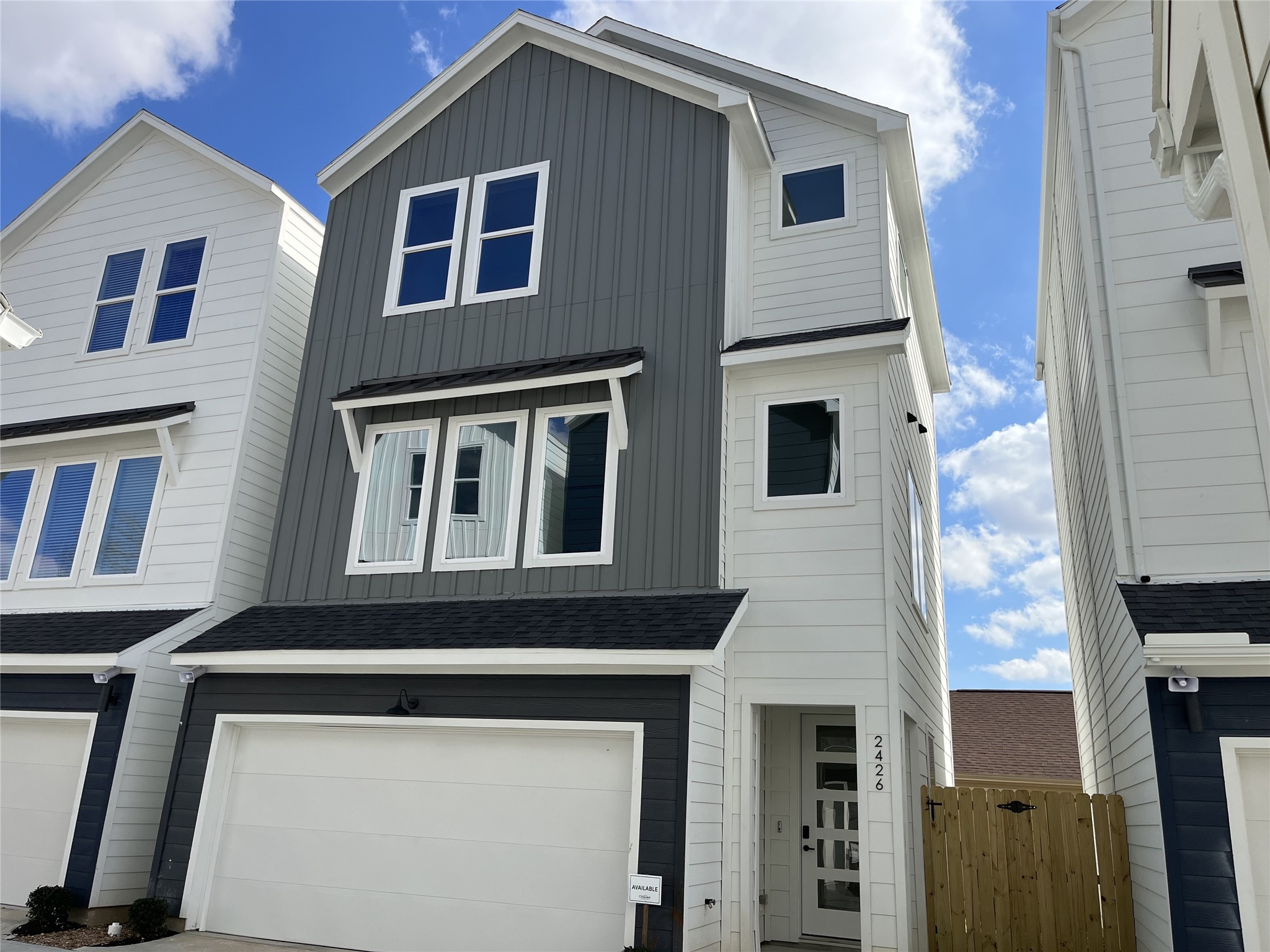 2426 Freeman Street Houston, TX 77009 - Photo 1 of 47 The striking façade is 2426 Freeman St., one of the six homes in the community. It showcases a modern three-story design, offering 3 bedrooms, 3.5 bathrooms, and a dedicated study, with clean lines and contemporary architecture that reflect stylish urban living.