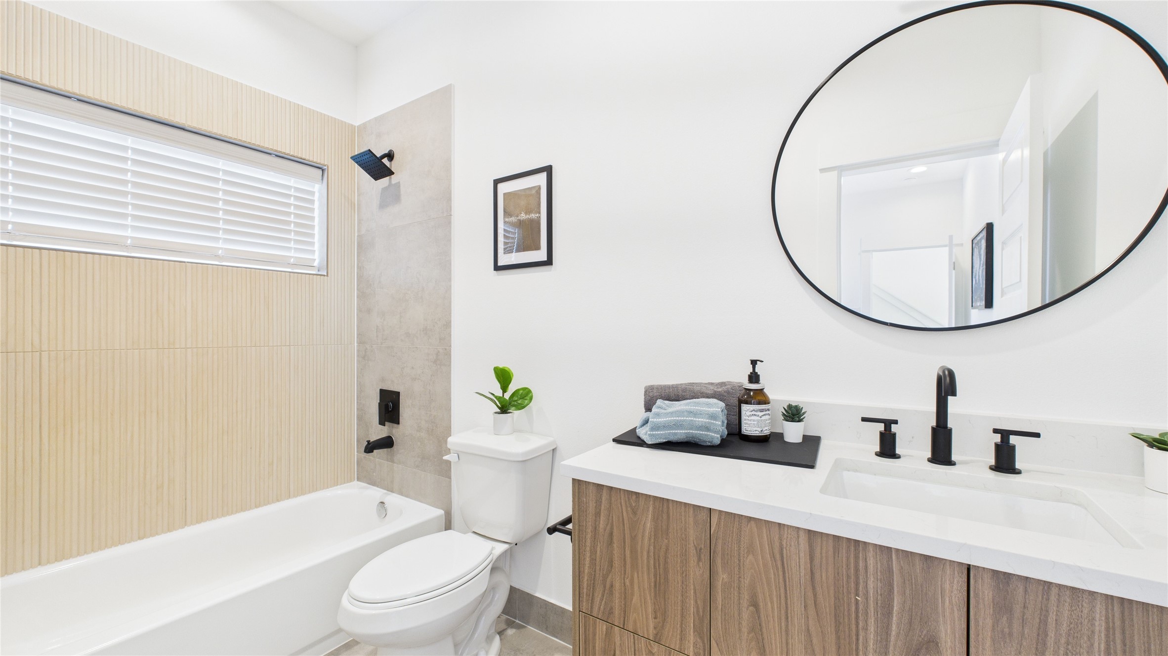 2426 Freeman Street Houston, TX 77009 - Photo 10 of 47 This first-floor secondary bedroom offers a private and convenient layout, featuring a spacious closet, a full ensuite bathroom, and direct access to the backyard ideal for guests or flexible everyday living.