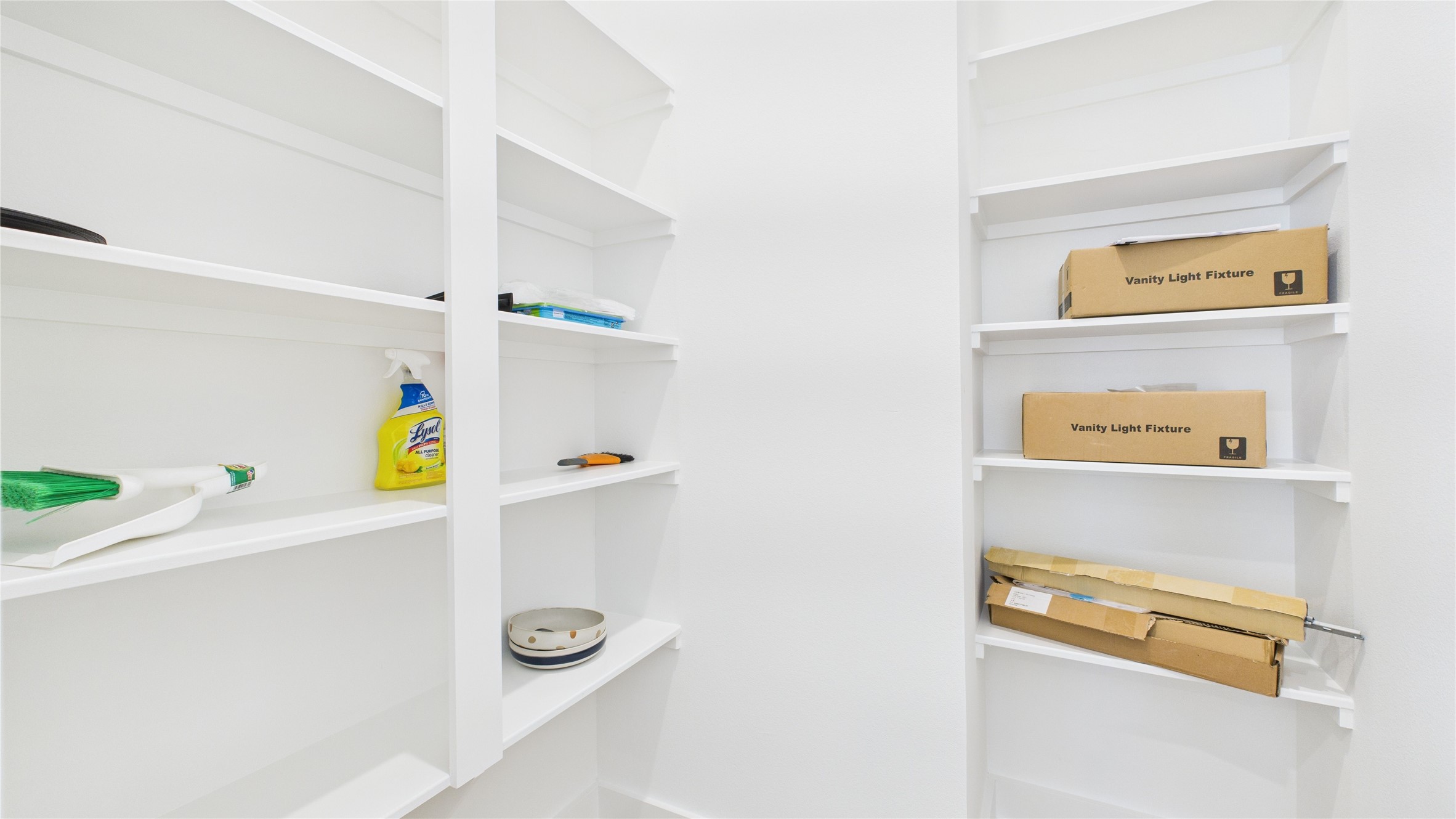 2426 Freeman Street Houston, TX 77009 - Photo 20 of 47 This spacious walk-in pantry offers ample shelving and storage, keeping the kitchen organized and functional while providing easy access for everyday cooking and entertaining needs.