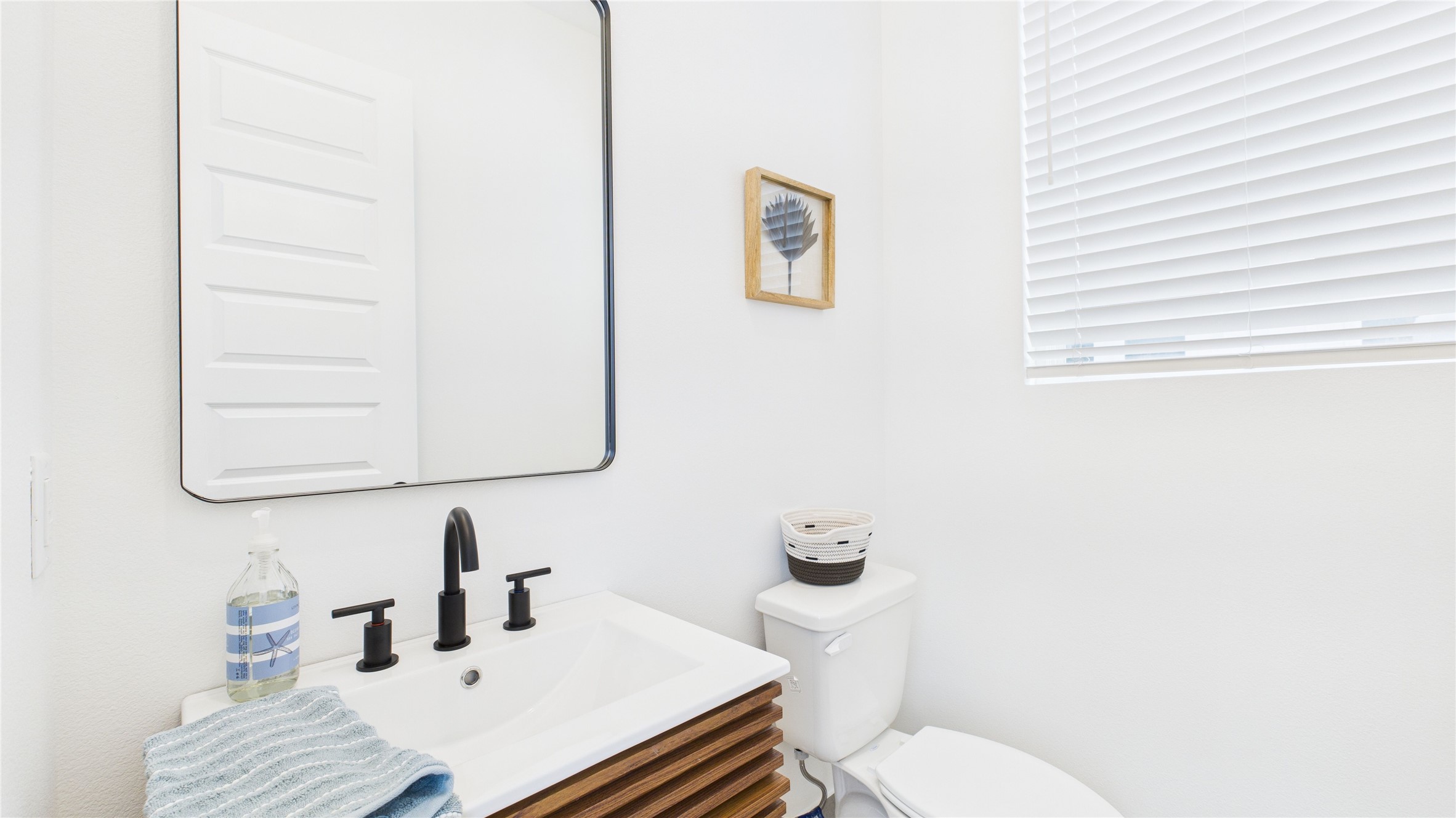 2426 Freeman Street Houston, TX 77009 - Photo 24 of 47 This convenient powder room, located just off the second-floor living area, is perfectly positioned for guests while keeping the bedroom spaces private, offering both functionality and comfort for entertaining.