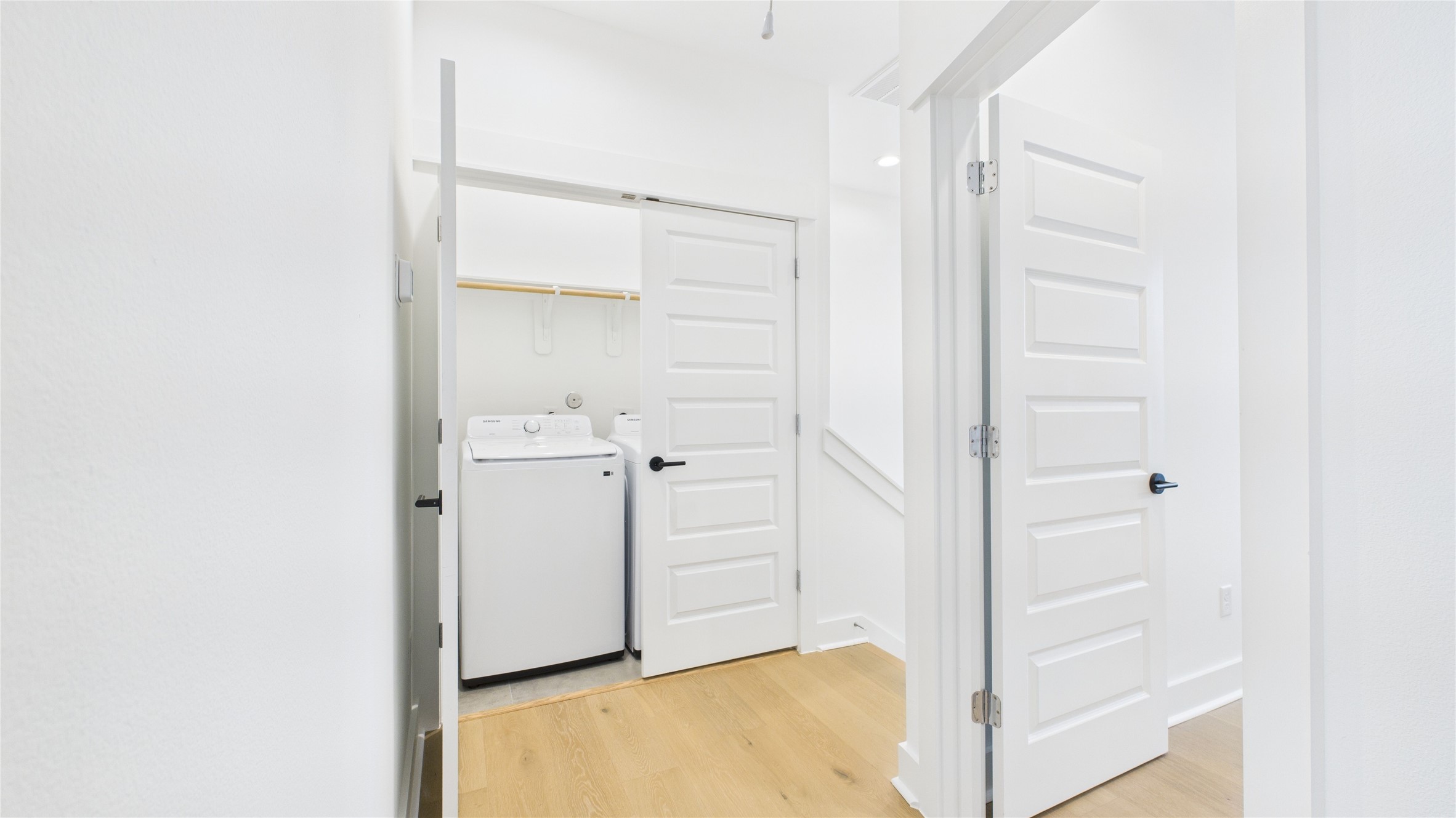 2426 Freeman Street Houston, TX 77009 - Photo 32 of 47 Conveniently located on hte third floor, the laundry area offers an efficient space equipped for all your laundry needs, thoughtfully designed to blend seamlessly with the home's layout for easy access and functionality.