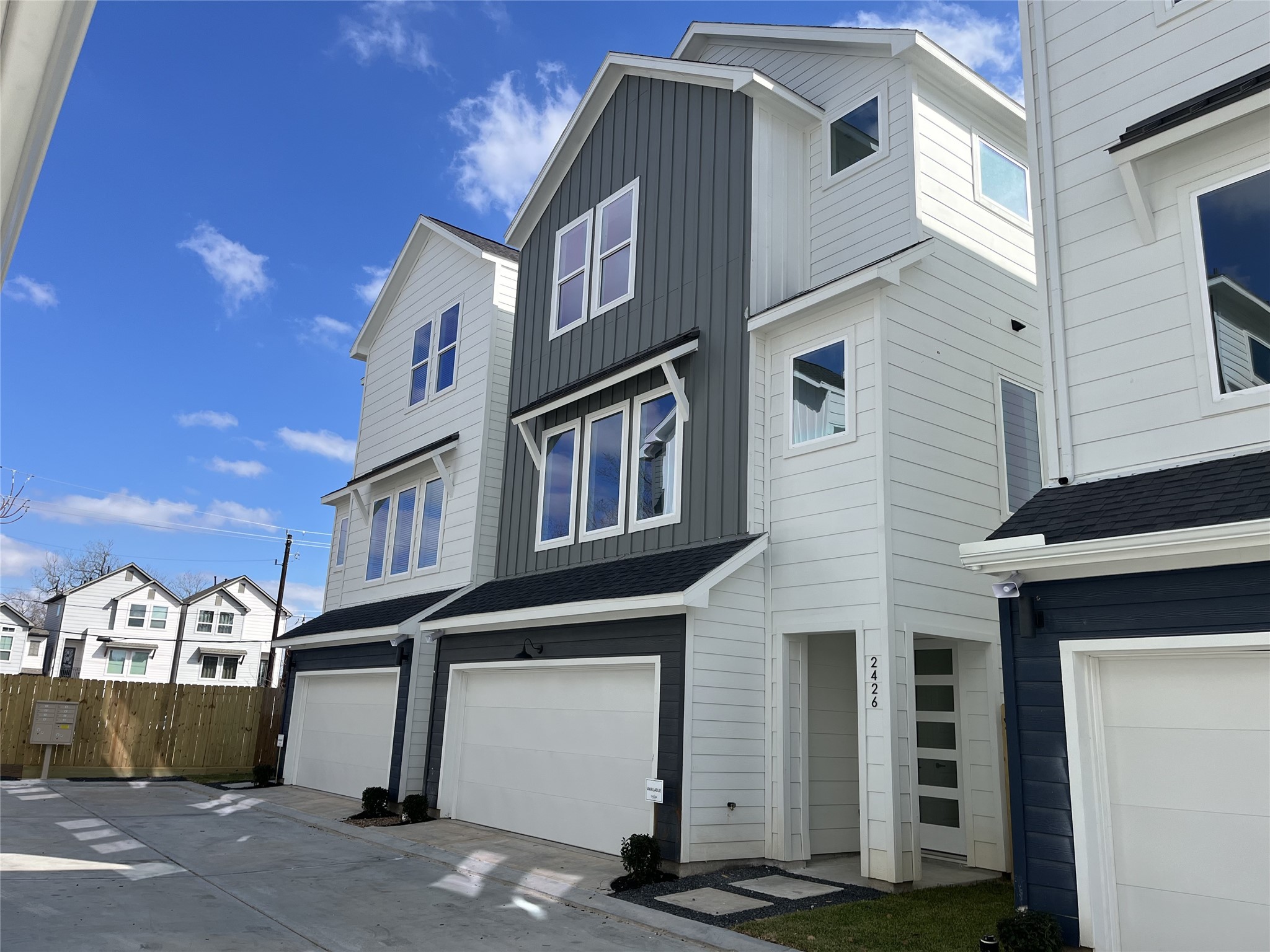 2426 Freeman Street Houston, TX 77009 - Photo 37 of 47 The striking façade is 2426 Freeman St., one of the six homes in the community. It showcases a modern three-story design, offering 3 bedrooms, 3.5 bathrooms, and a dedicated study, with clean lines and contemporary architecture that reflect stylish urban living.