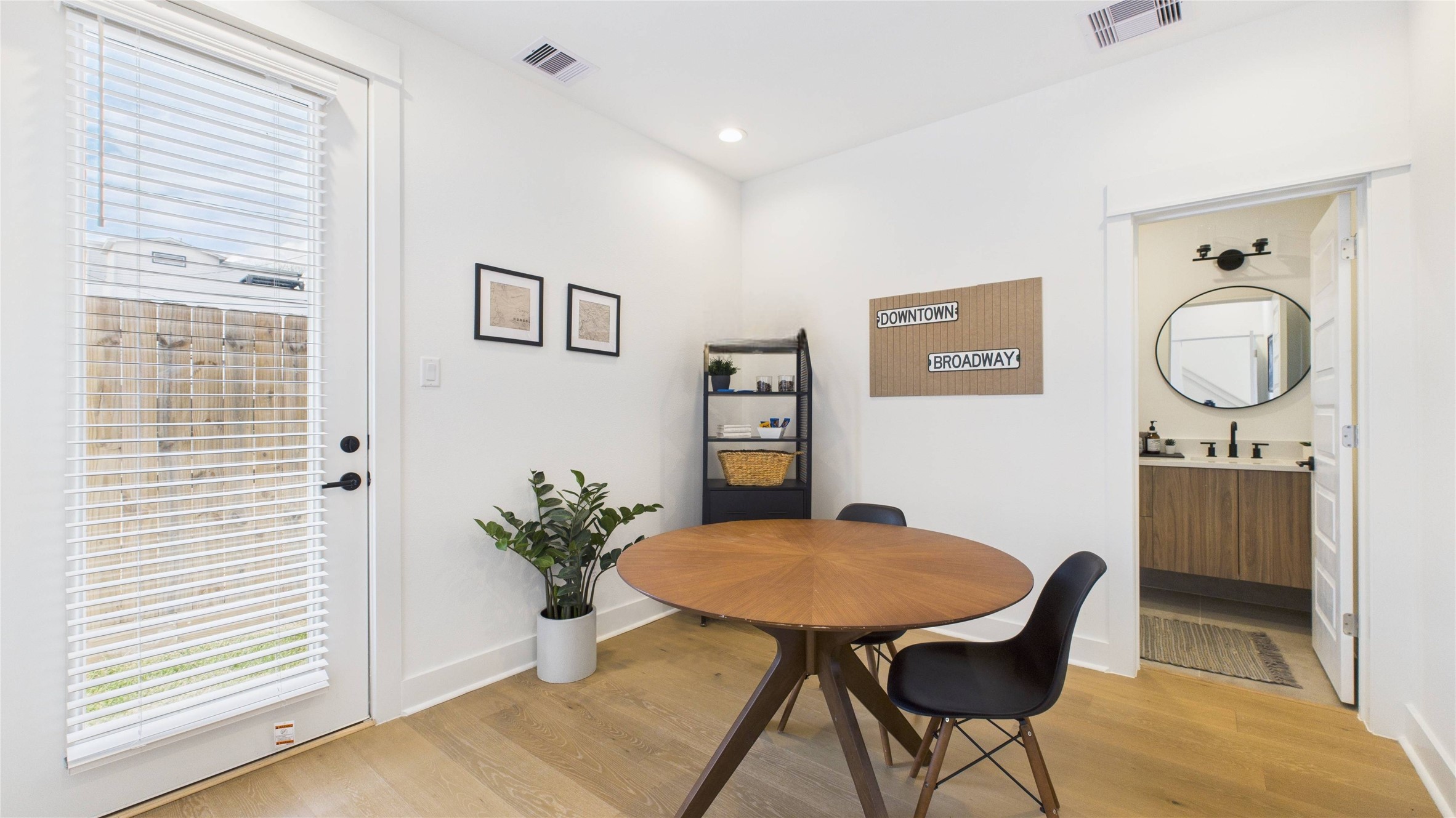 2426 Freeman Street Houston, TX 77009 - Photo 6 of 47 This first-floor secondary bedroom offers a private and convenient layout, featuring a spacious closet, a full ensuite bathroom, and direct access to the backyard ideal for guests or flexible everyday living.