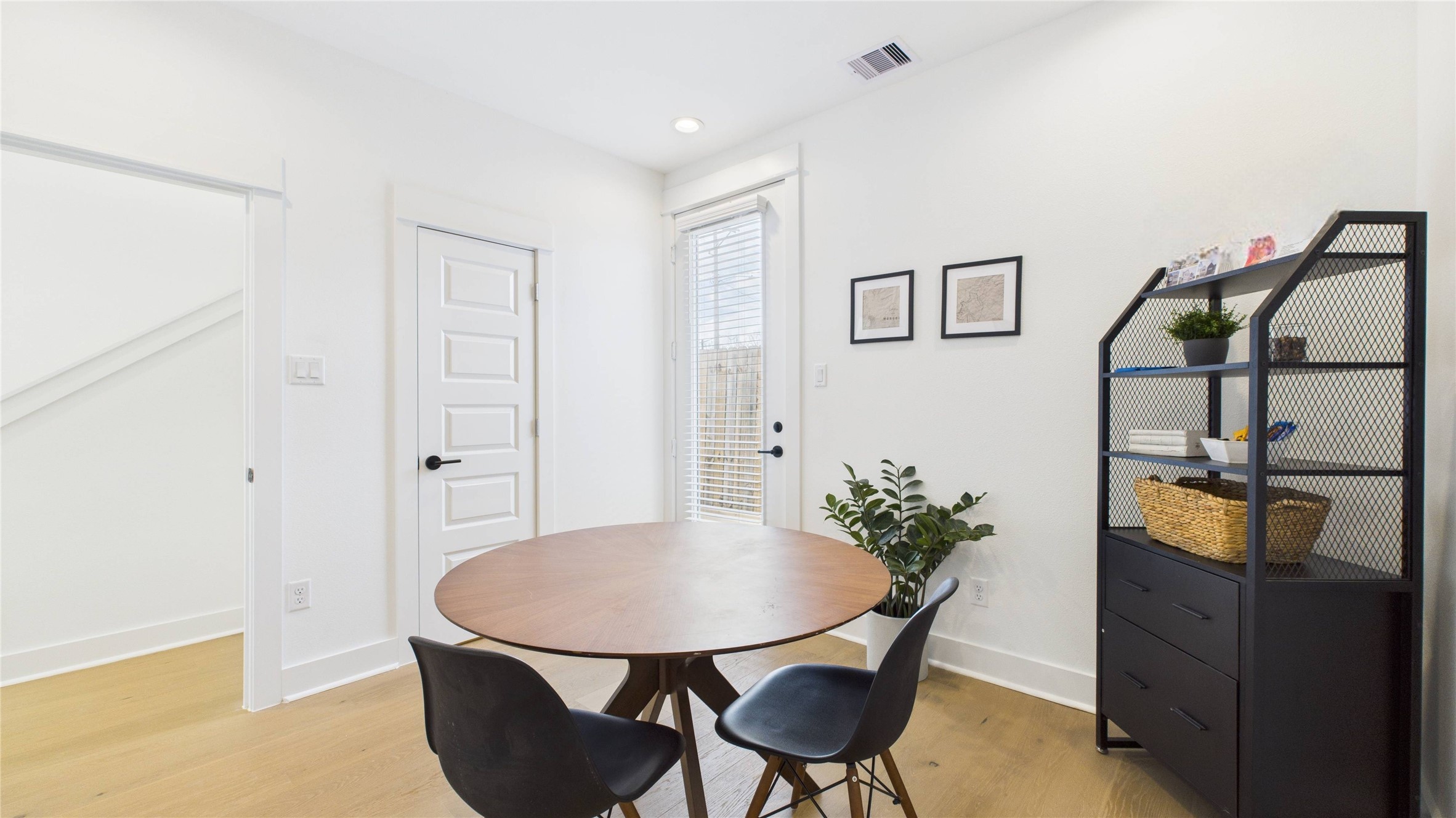 2426 Freeman Street Houston, TX 77009 - Photo 7 of 47 This first-floor secondary bedroom offers a private and convenient layout, featuring a spacious closet, a full ensuite bathroom, and direct access to the backyard ideal for guests or flexible everyday living.