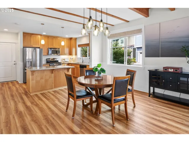 a dining room with furniture and window