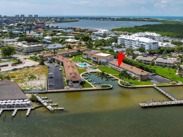 an aerial view of a house with a lake view